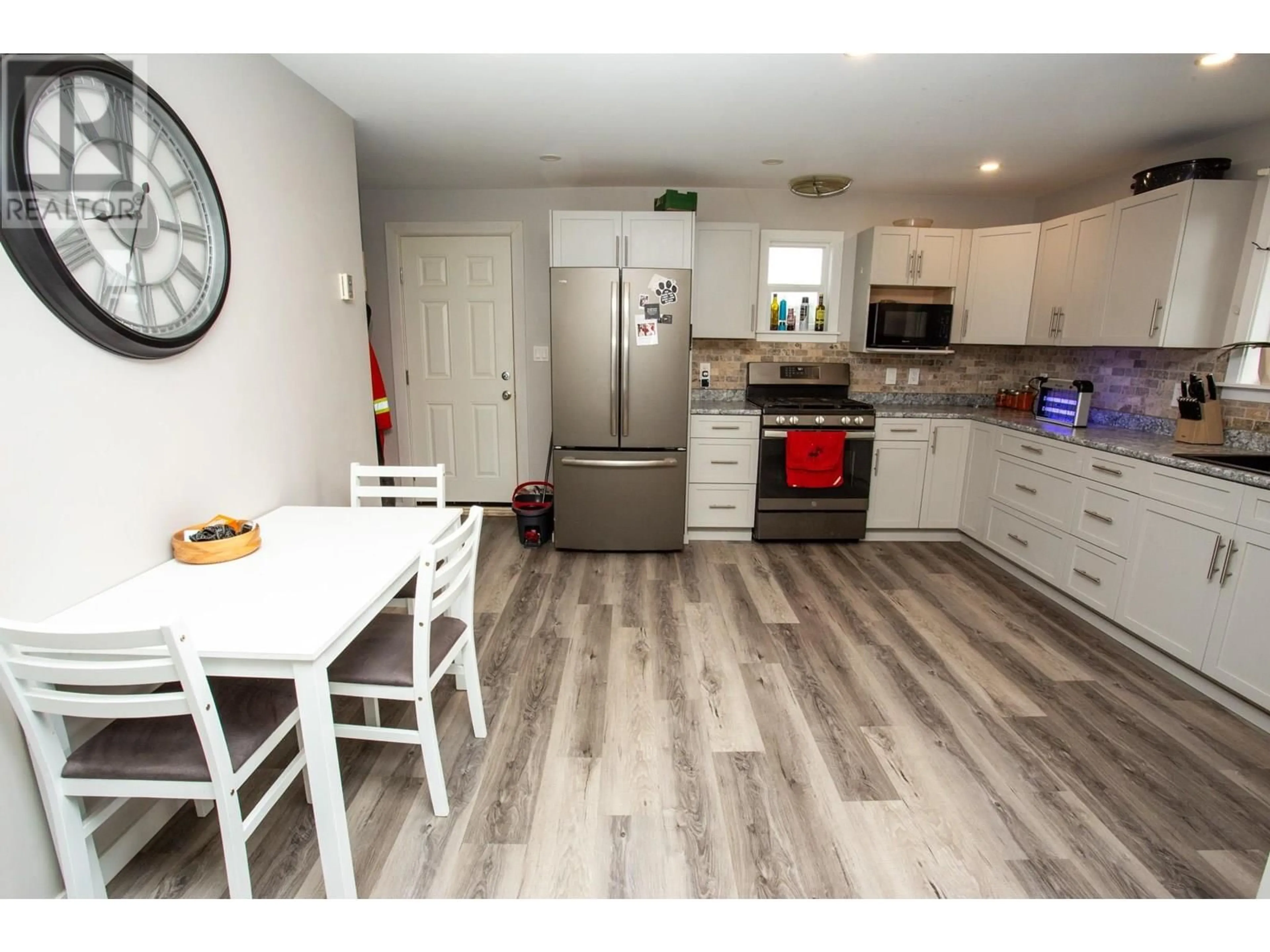 Open concept kitchen, wood/laminate floor for 24420 HART HIGHWAY, Prince George British Columbia V2K5X2
