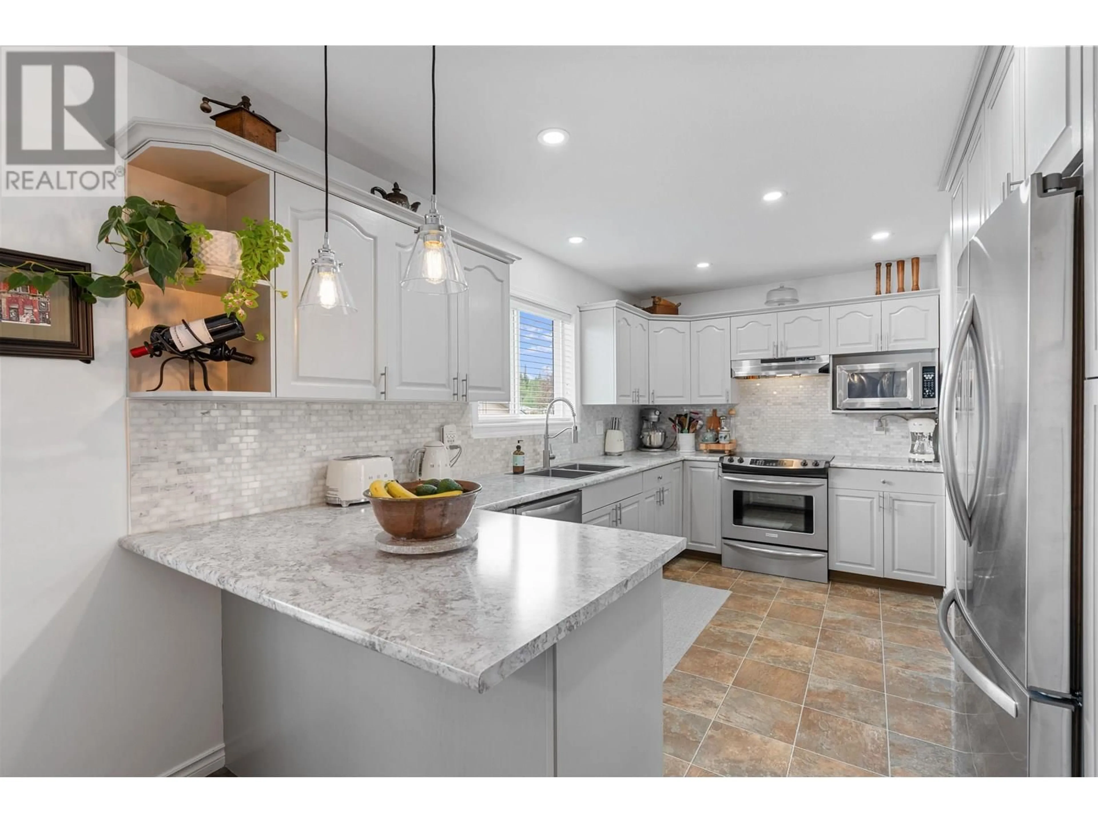 Open concept kitchen, ceramic/tile floor for 6845 WESTGATE AVENUE, Prince George British Columbia V2N5R2