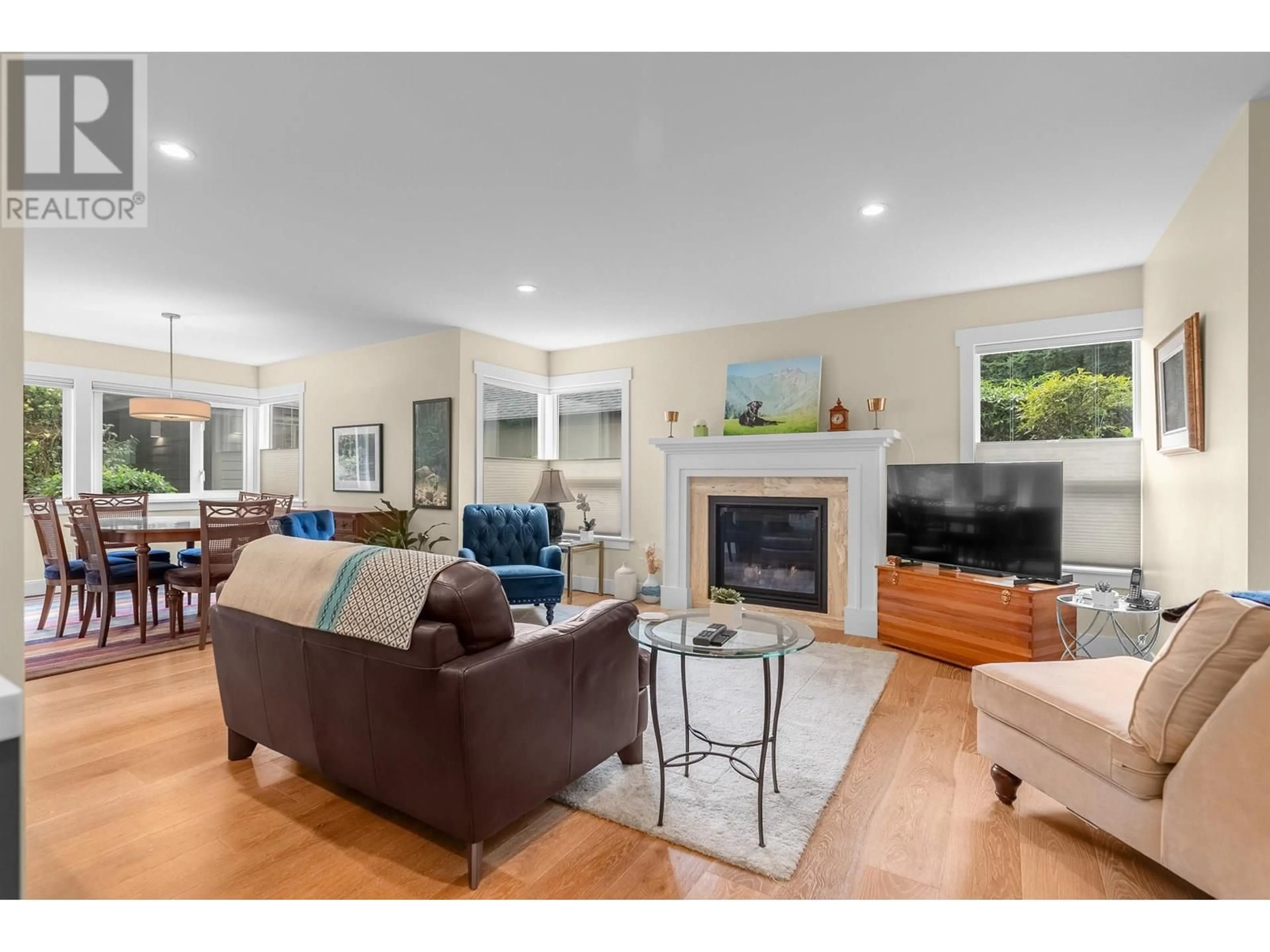 Living room with furniture, wood/laminate floor for 5916 NANCY GREENE WAY, North Vancouver British Columbia V7R4N4