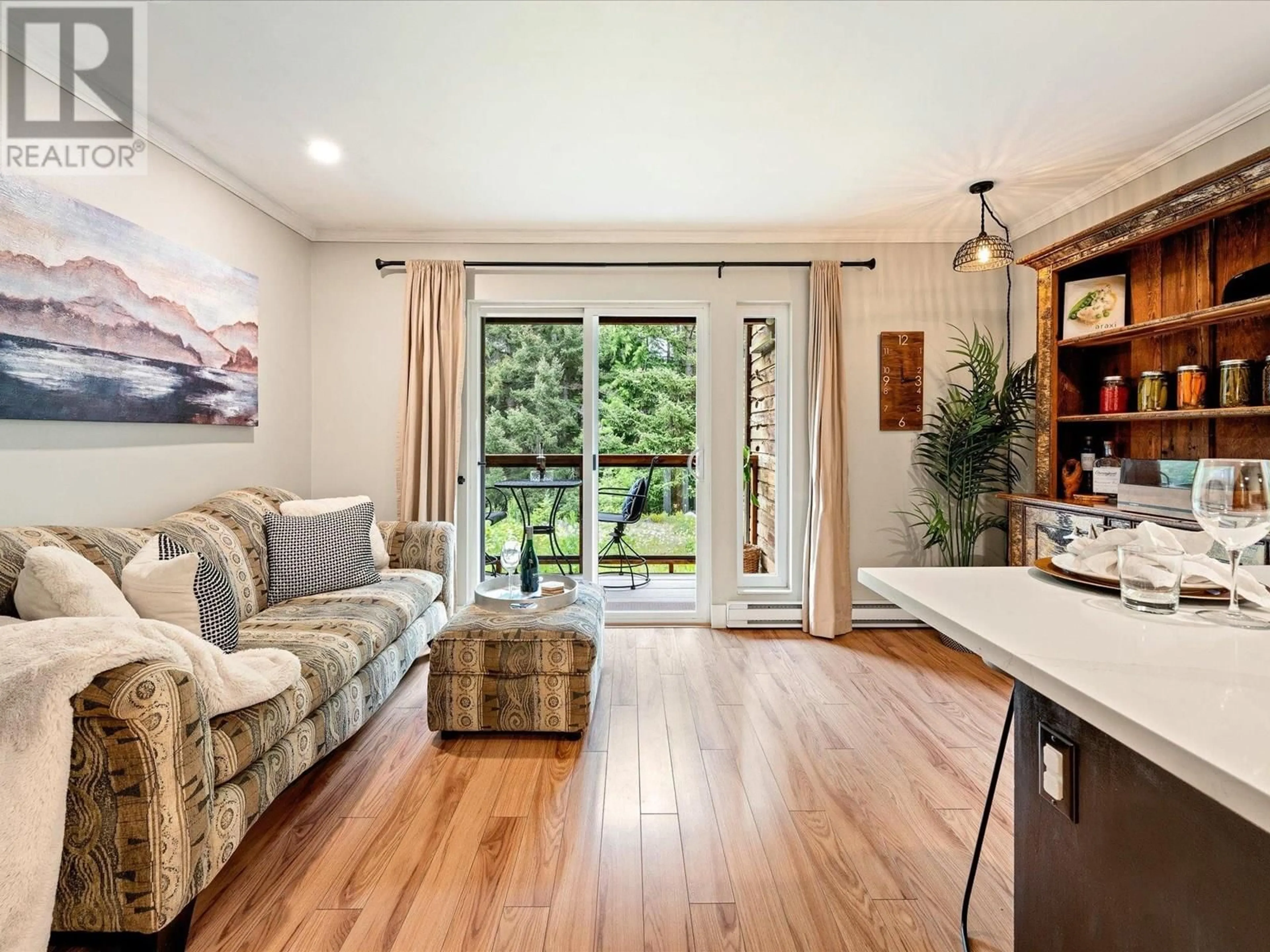 Living room with furniture, wood/laminate floor for 4 - 7001 NESTERS ROAD, Whistler British Columbia V8E0X1