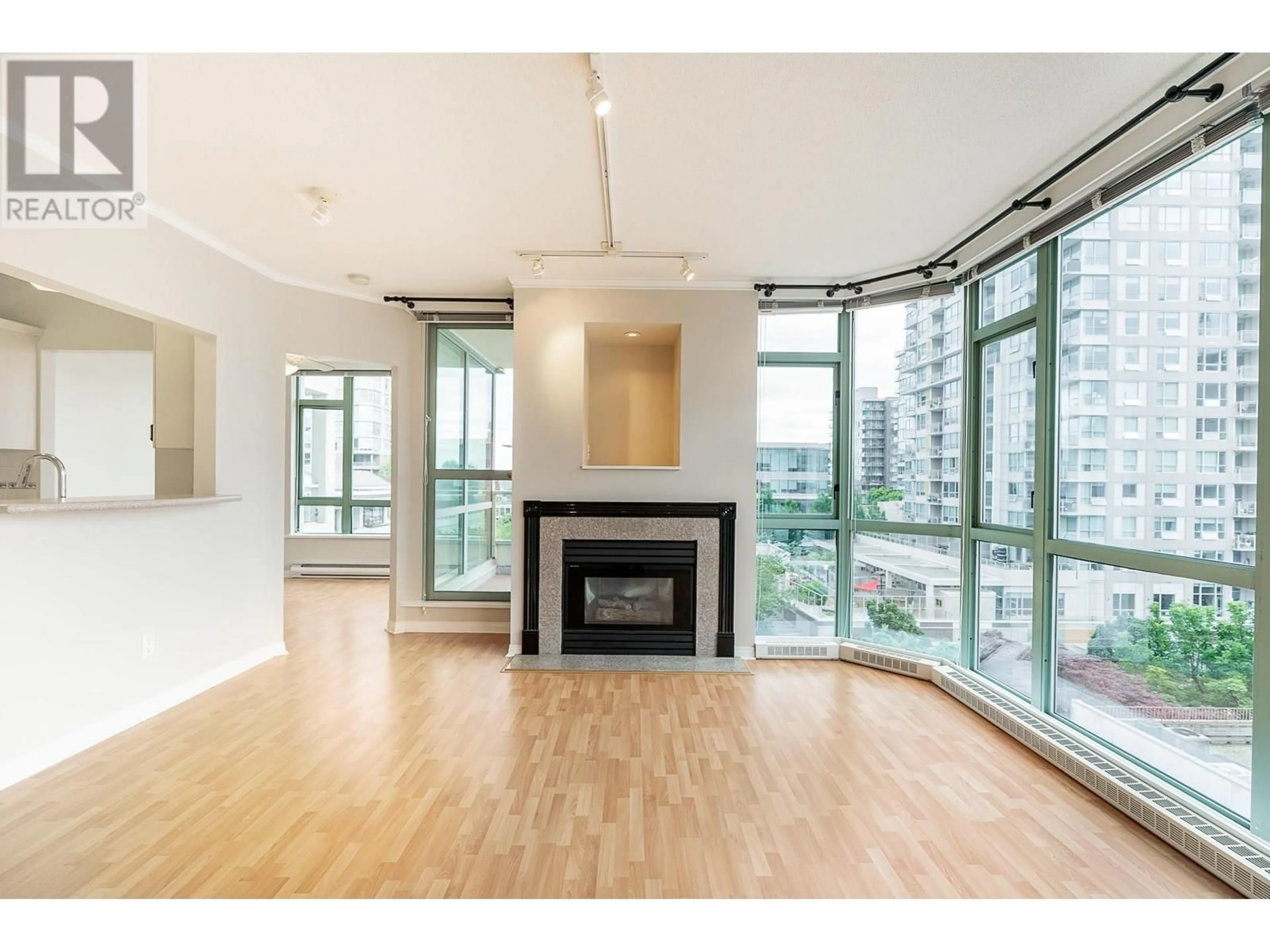 Living room with furniture, wood/laminate floor for 604 - 140 14TH STREET, North Vancouver British Columbia V7L2N3