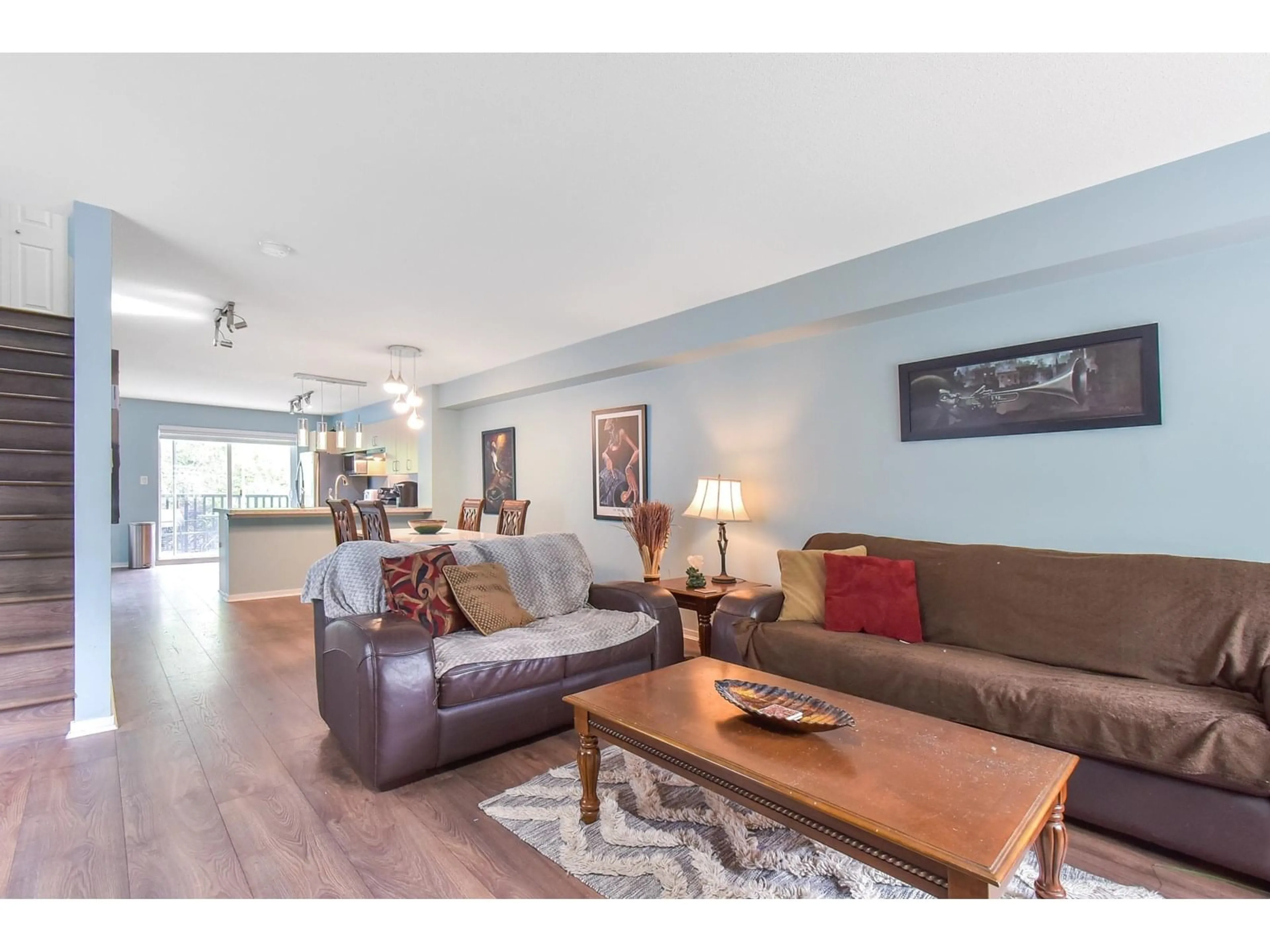 Living room with furniture, wood/laminate floor for 36 - 15155 62A, Surrey British Columbia V3S8A6