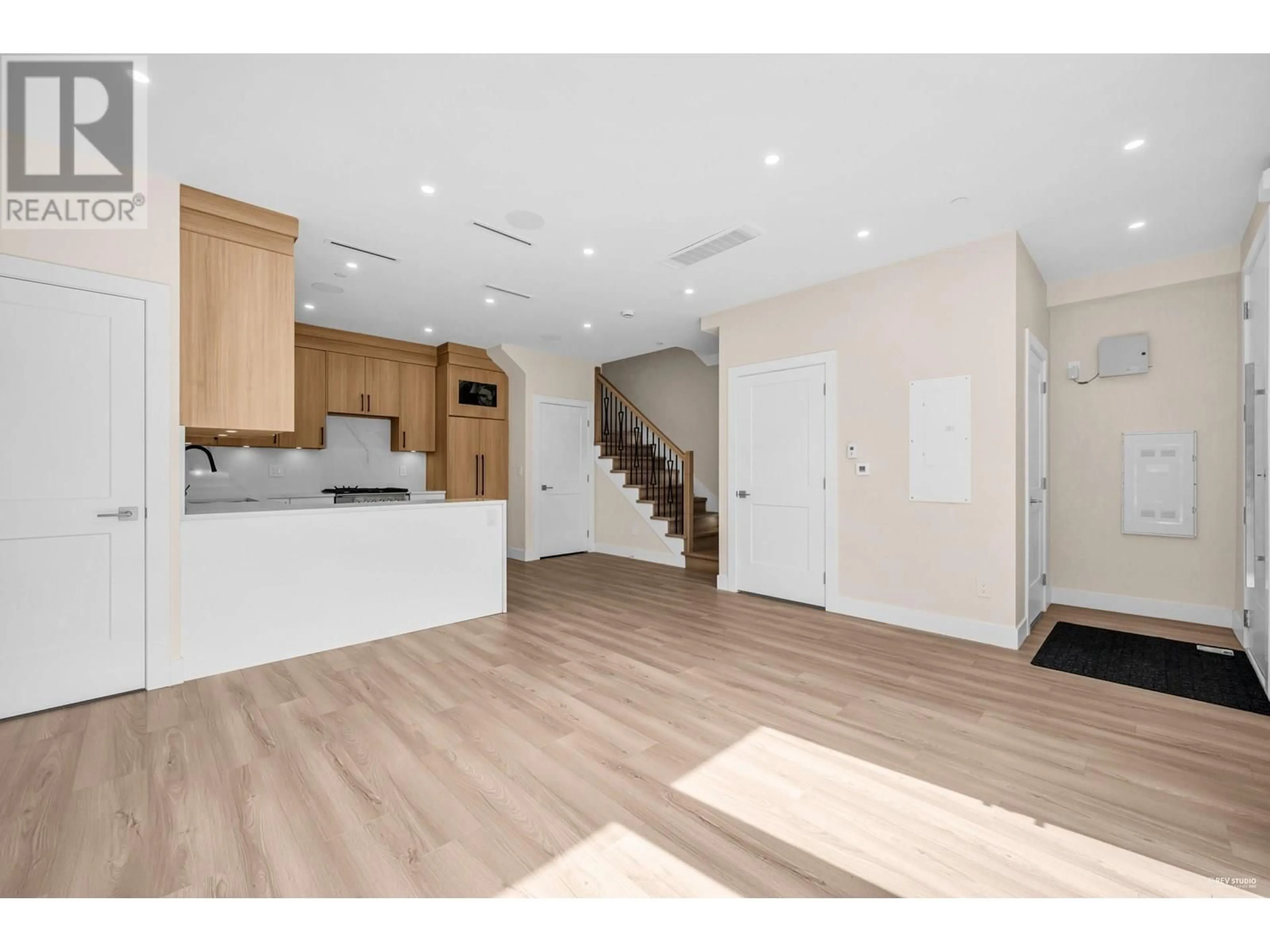 Open concept kitchen, wood/laminate floor for 2371 ADANAC STREET, Vancouver British Columbia V5L2E9