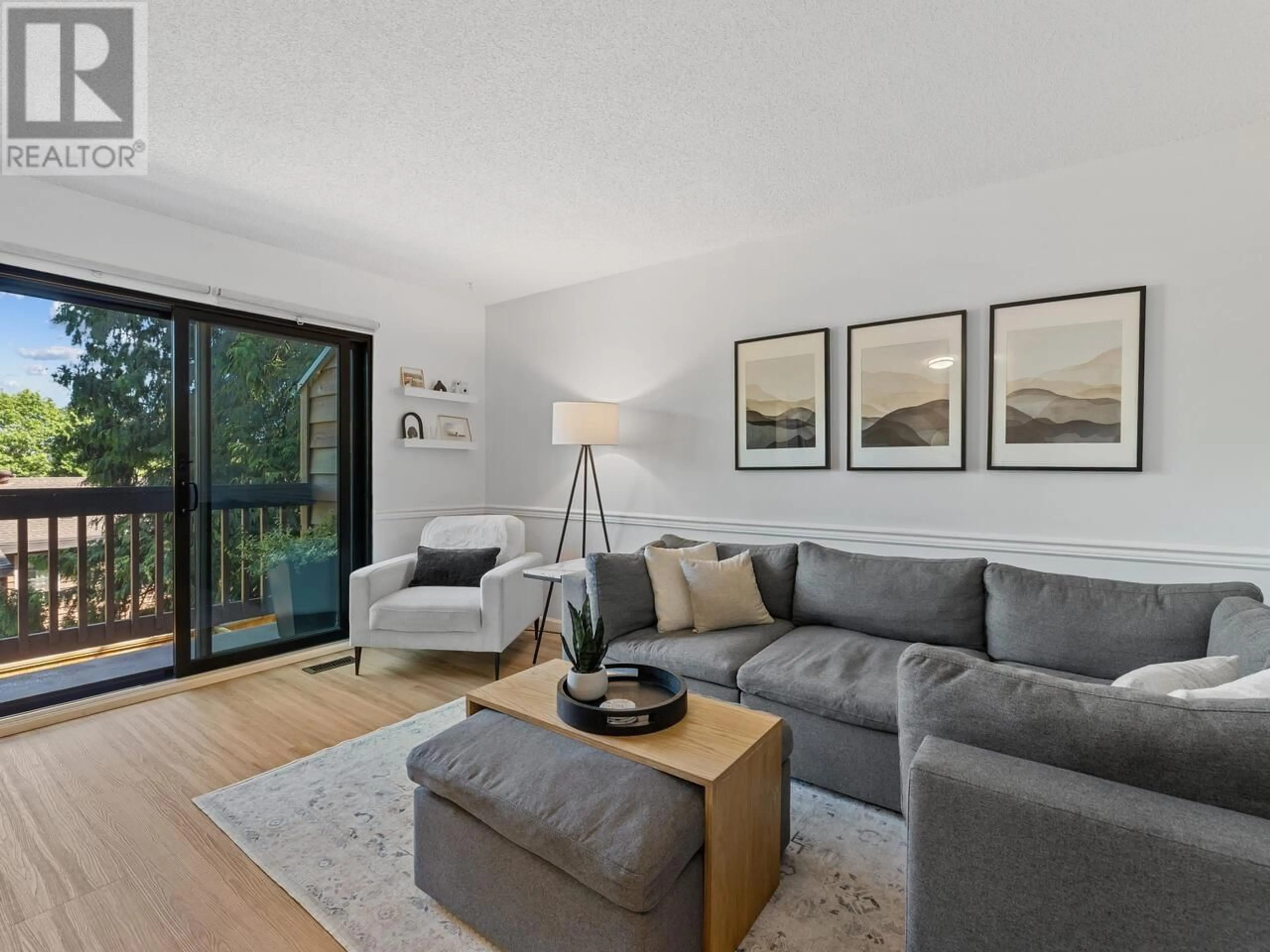 Living room with furniture, wood/laminate floor for 236 CARDIFF WAY, Port Moody British Columbia V3H3X8