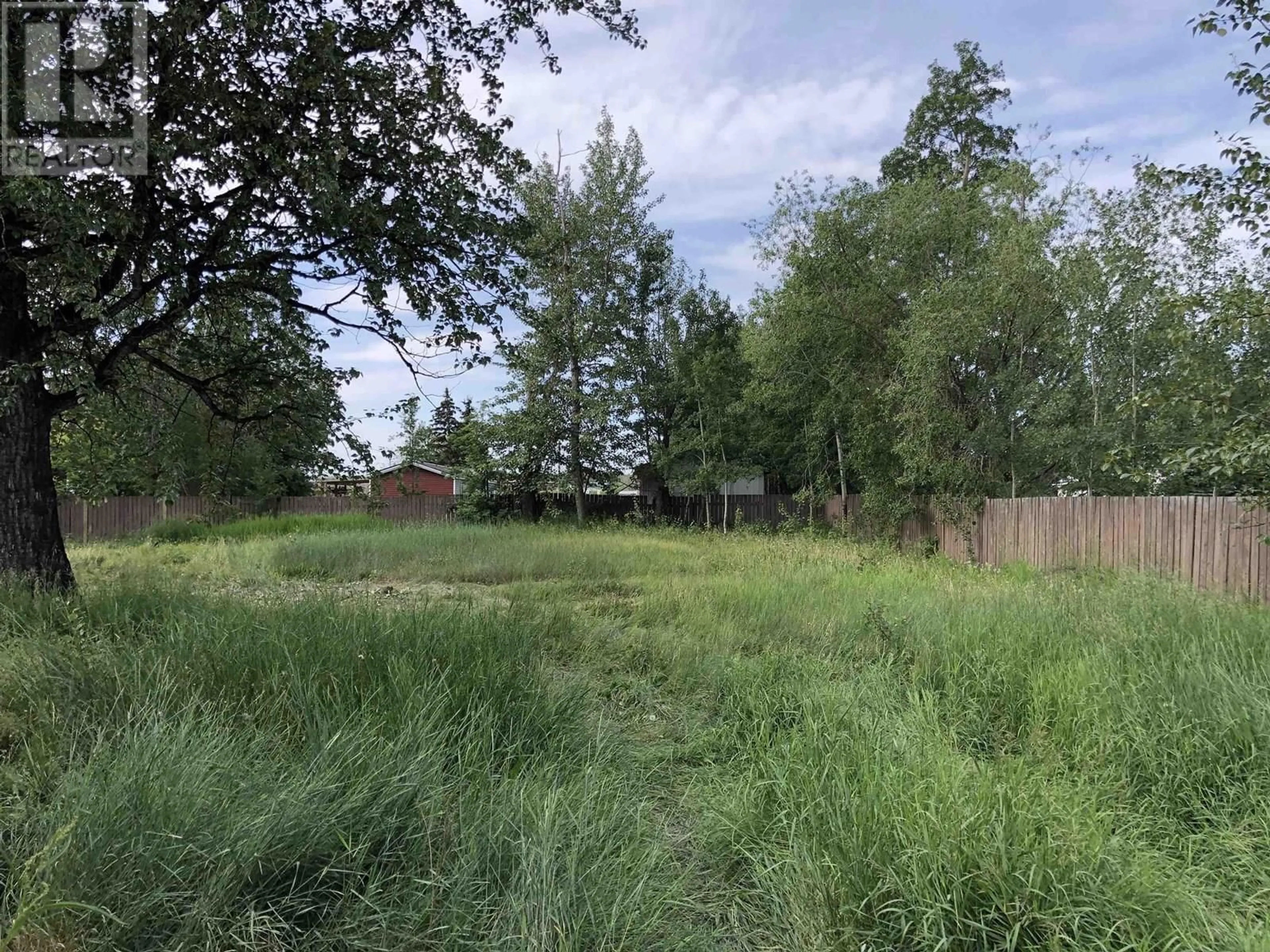 A pic from outside/outdoor area/front of a property/back of a property/a pic from drone, forest/trees view for 12215 FIR AVENUE, Fort St. John British Columbia V1J8E5