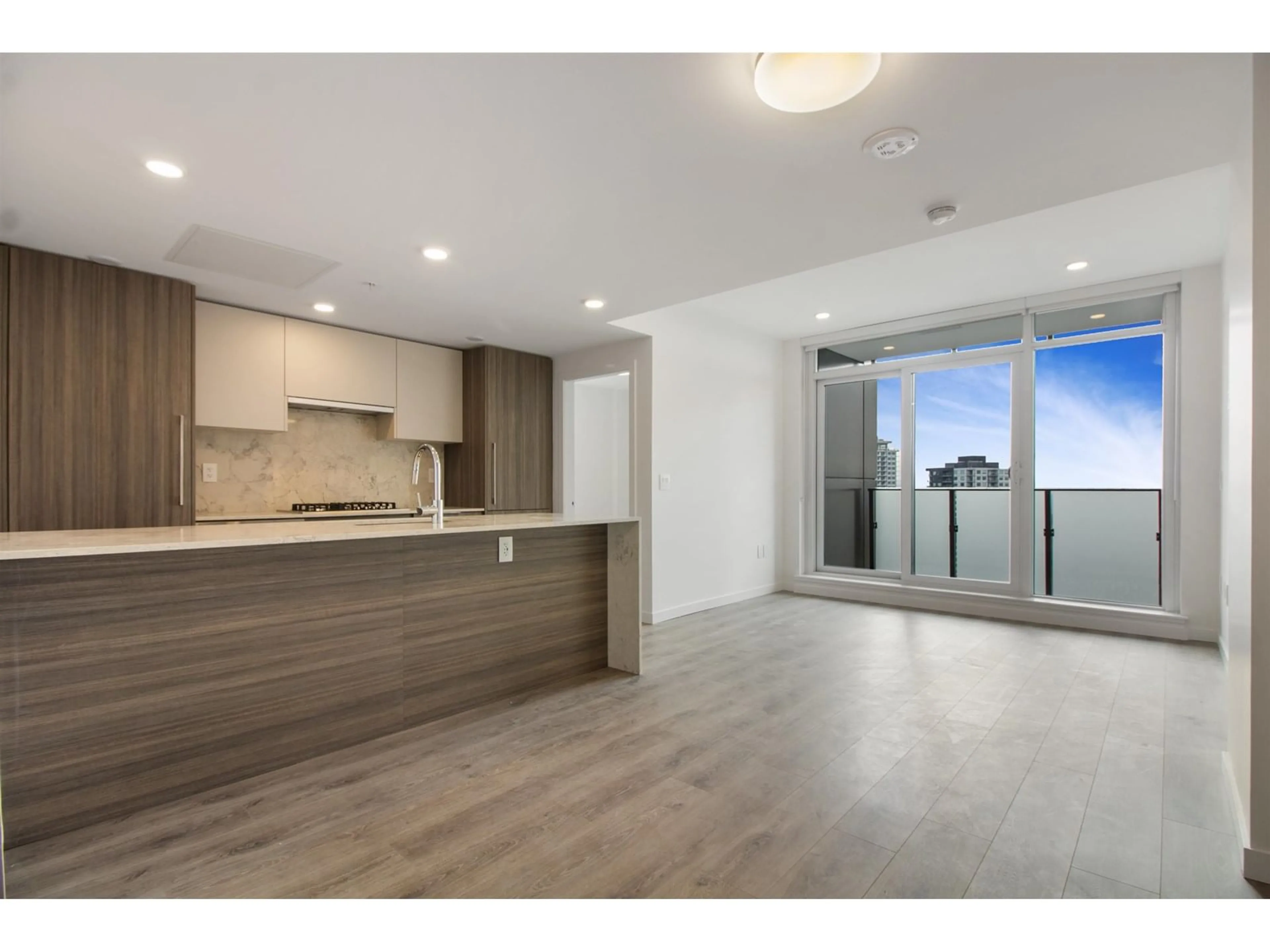 Open concept kitchen, wood/laminate floor for 2502 - 10333 133, Surrey British Columbia V3R2H4