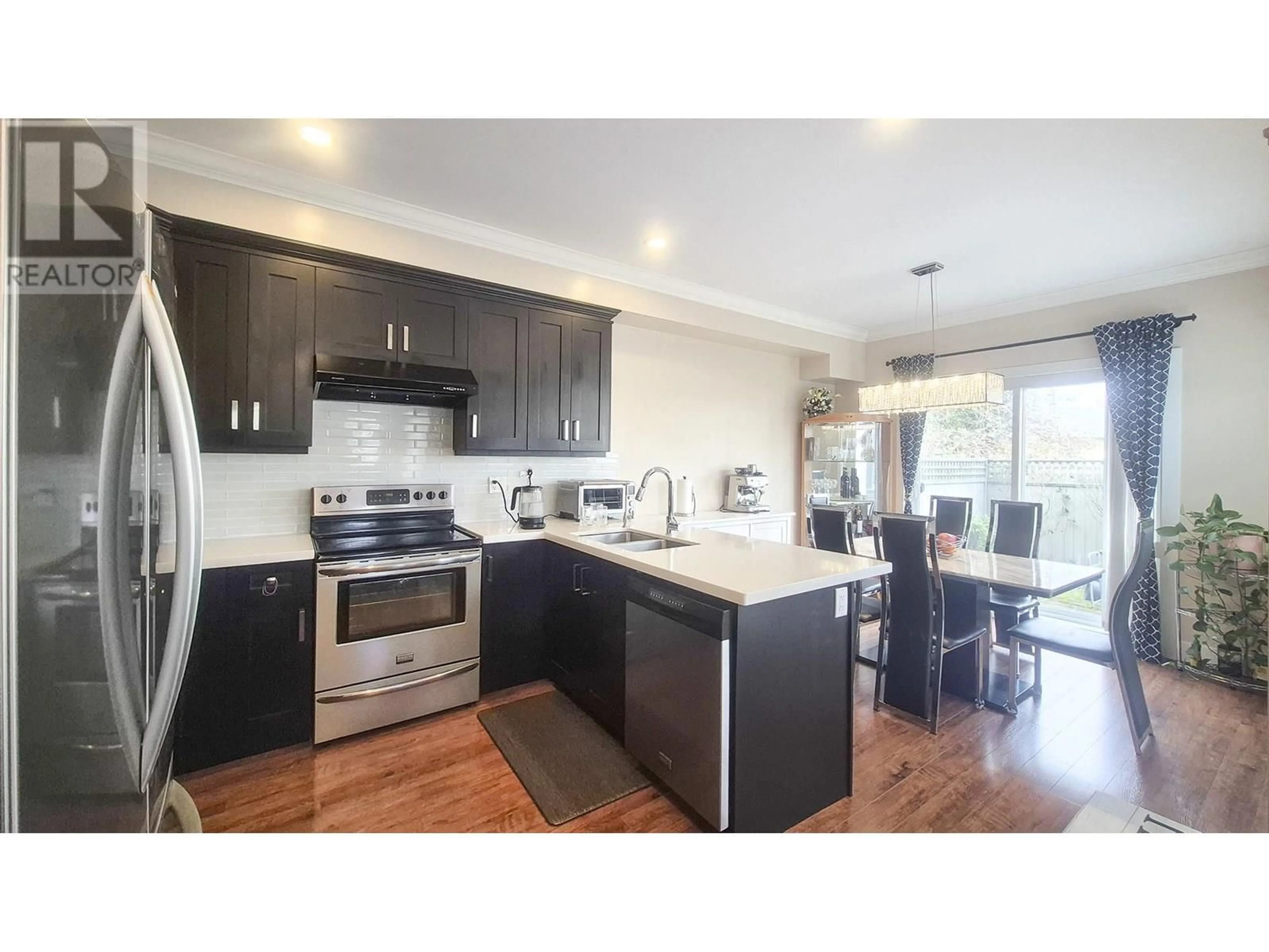 Open concept kitchen, wood/laminate floor for 1 - 9131 WILLIAMS ROAD, Richmond British Columbia V7A1G8