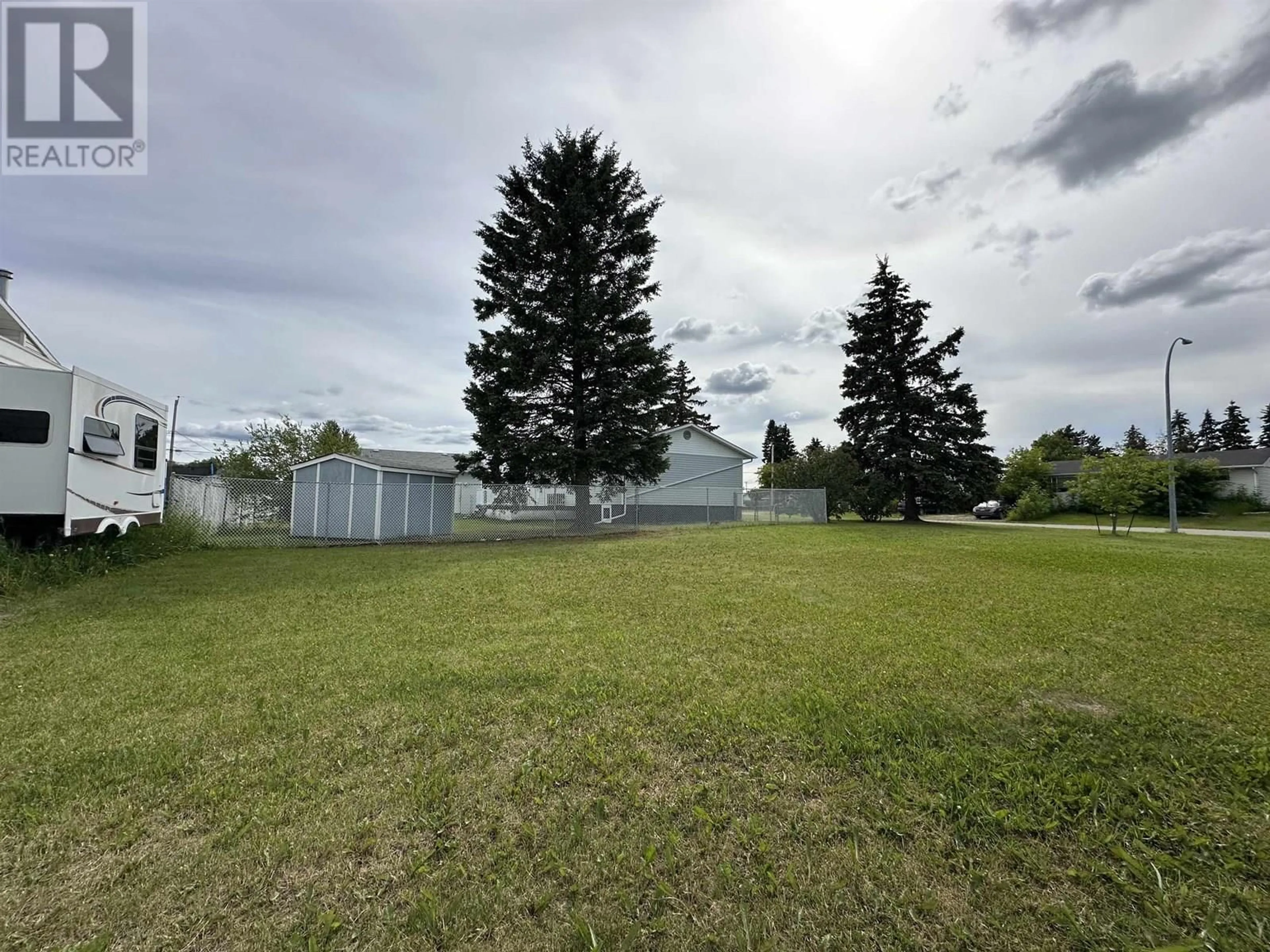 A pic from outside/outdoor area/front of a property/back of a property/a pic from drone, unknown for 9715 81 STREET, Fort St. John British Columbia V1J3C2