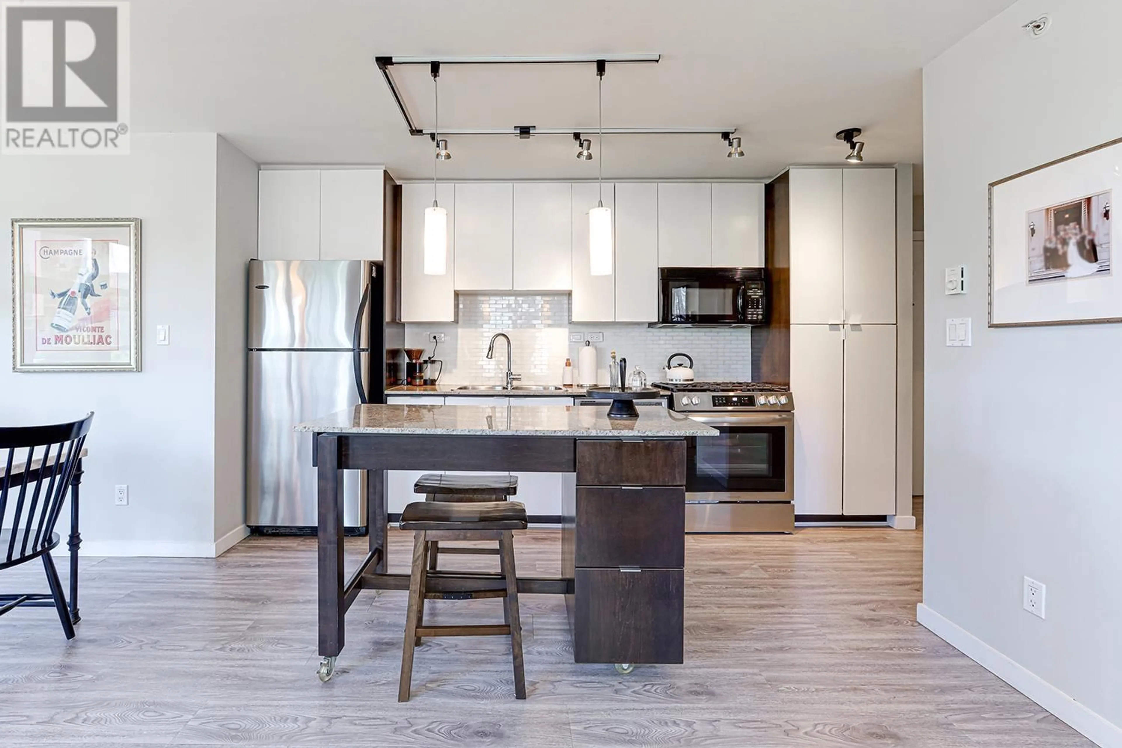 Open concept kitchen, wood/laminate floor for 603 - 989 BEATTY STREET, Vancouver British Columbia V6Z3C2