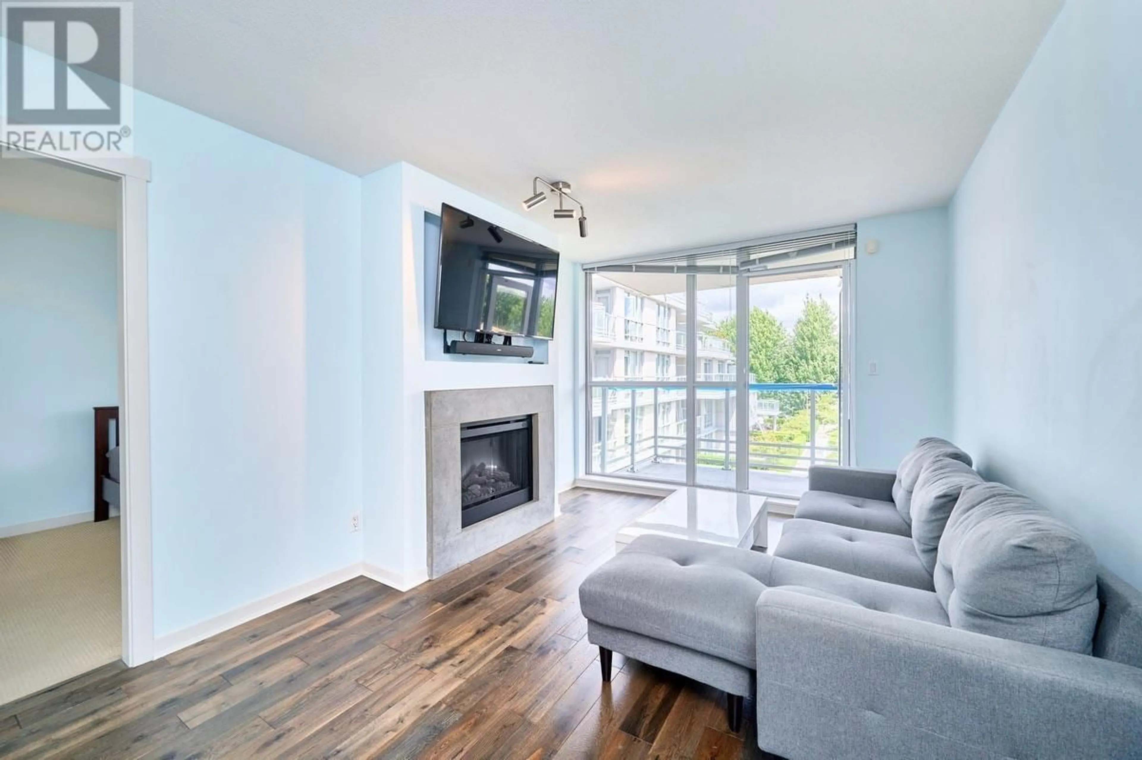 Living room with furniture, wood/laminate floor for 317 - 9371 HEMLOCK DRIVE, Richmond British Columbia V6Y4K6