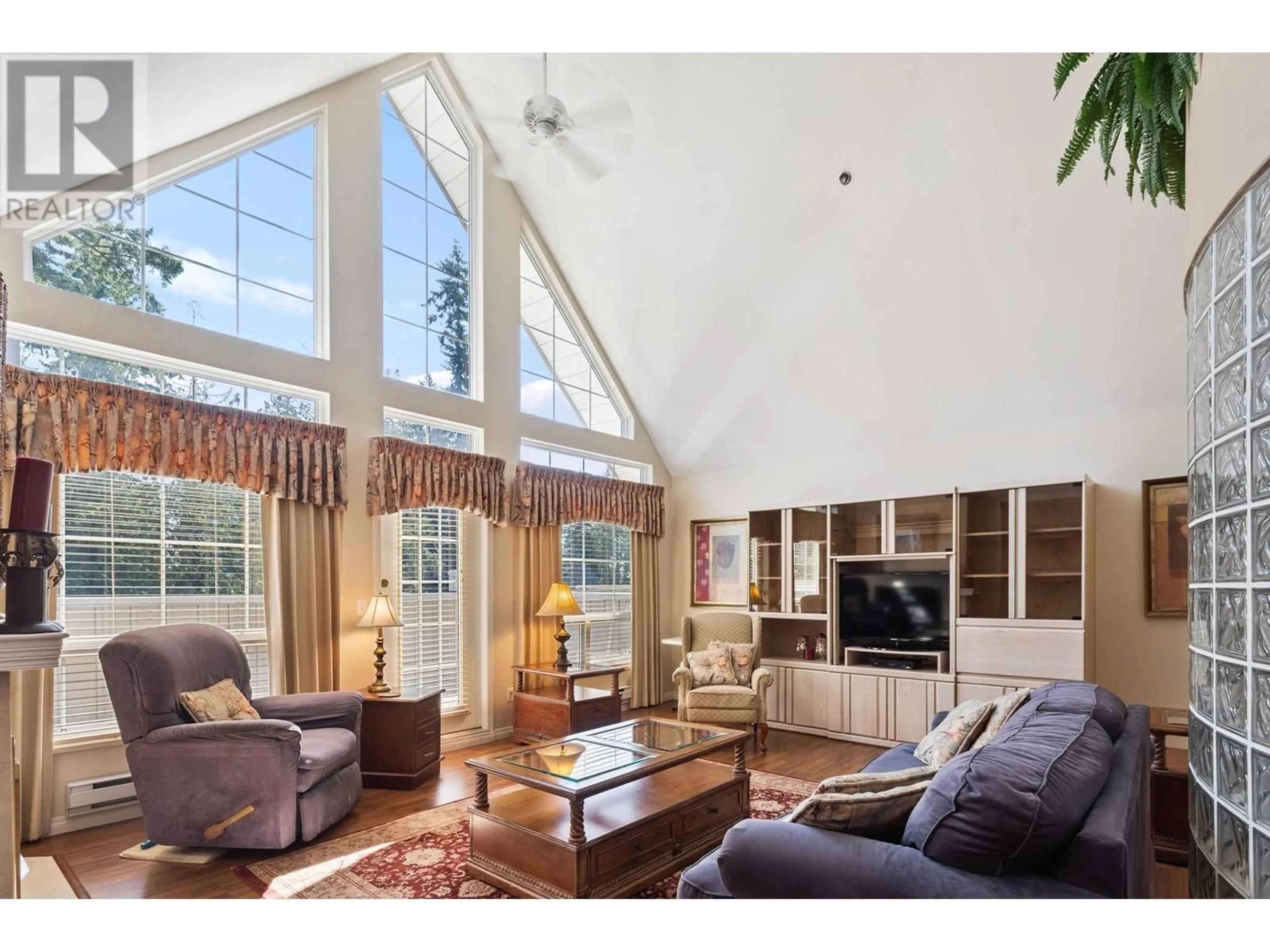 Living room with furniture, wood/laminate floor for 402 - 1154 WESTWOOD STREET, Coquitlam British Columbia V3B7J1