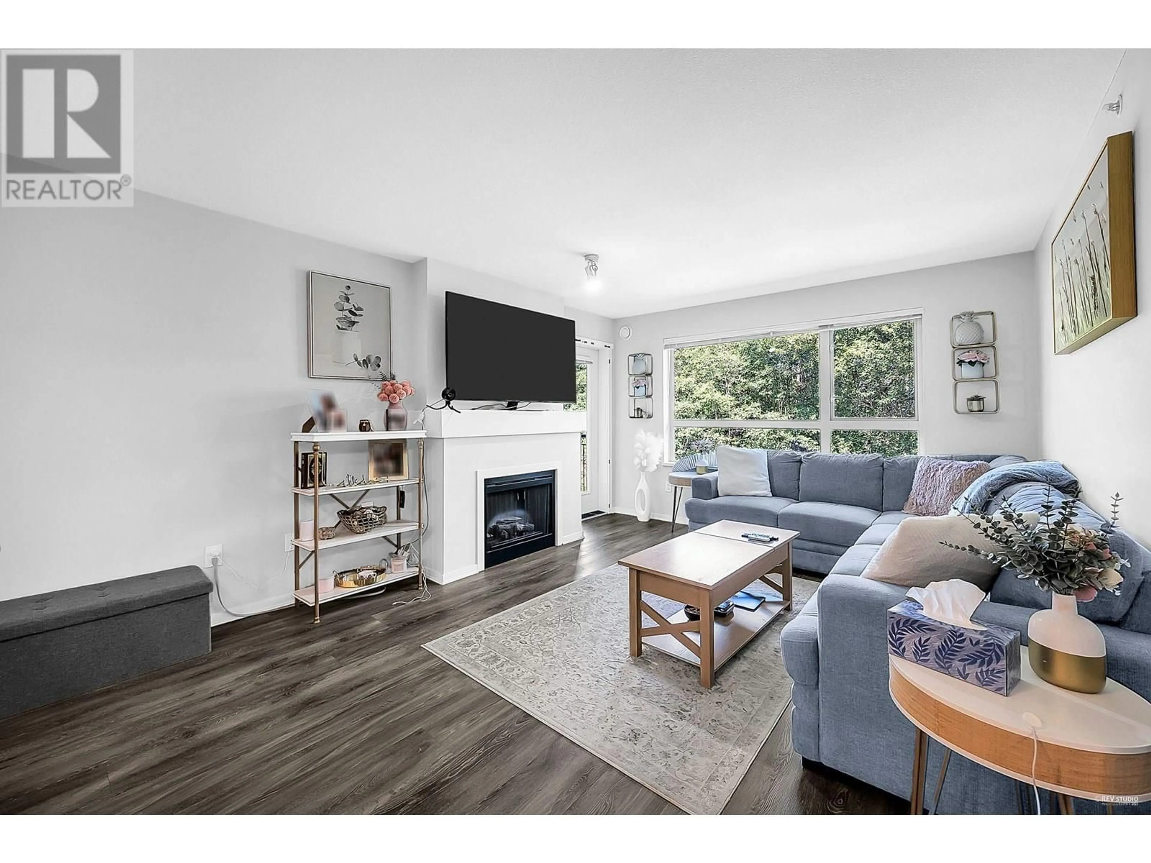 Living room with furniture, wood/laminate floor for 422 - 700 KLAHANIE DRIVE, Port Moody British Columbia V3H5L3