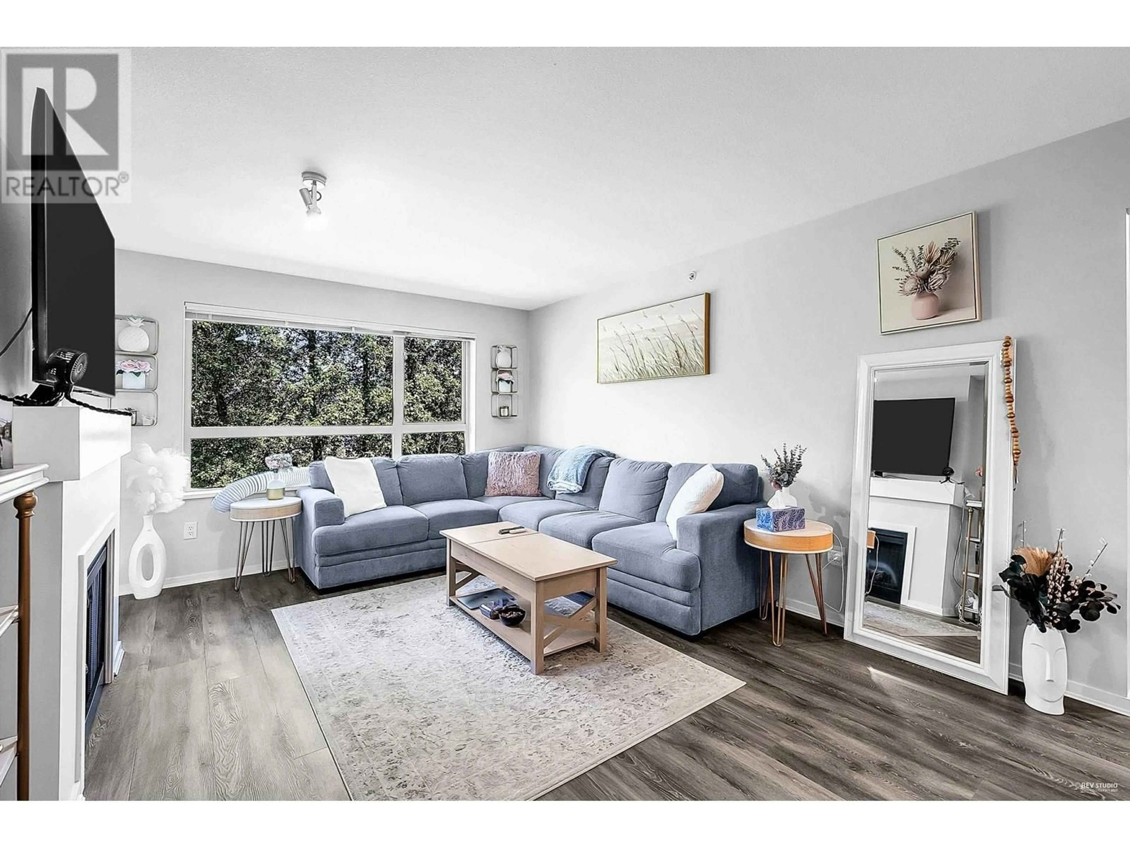 Living room with furniture, wood/laminate floor for 422 - 700 KLAHANIE DRIVE, Port Moody British Columbia V3H5L3