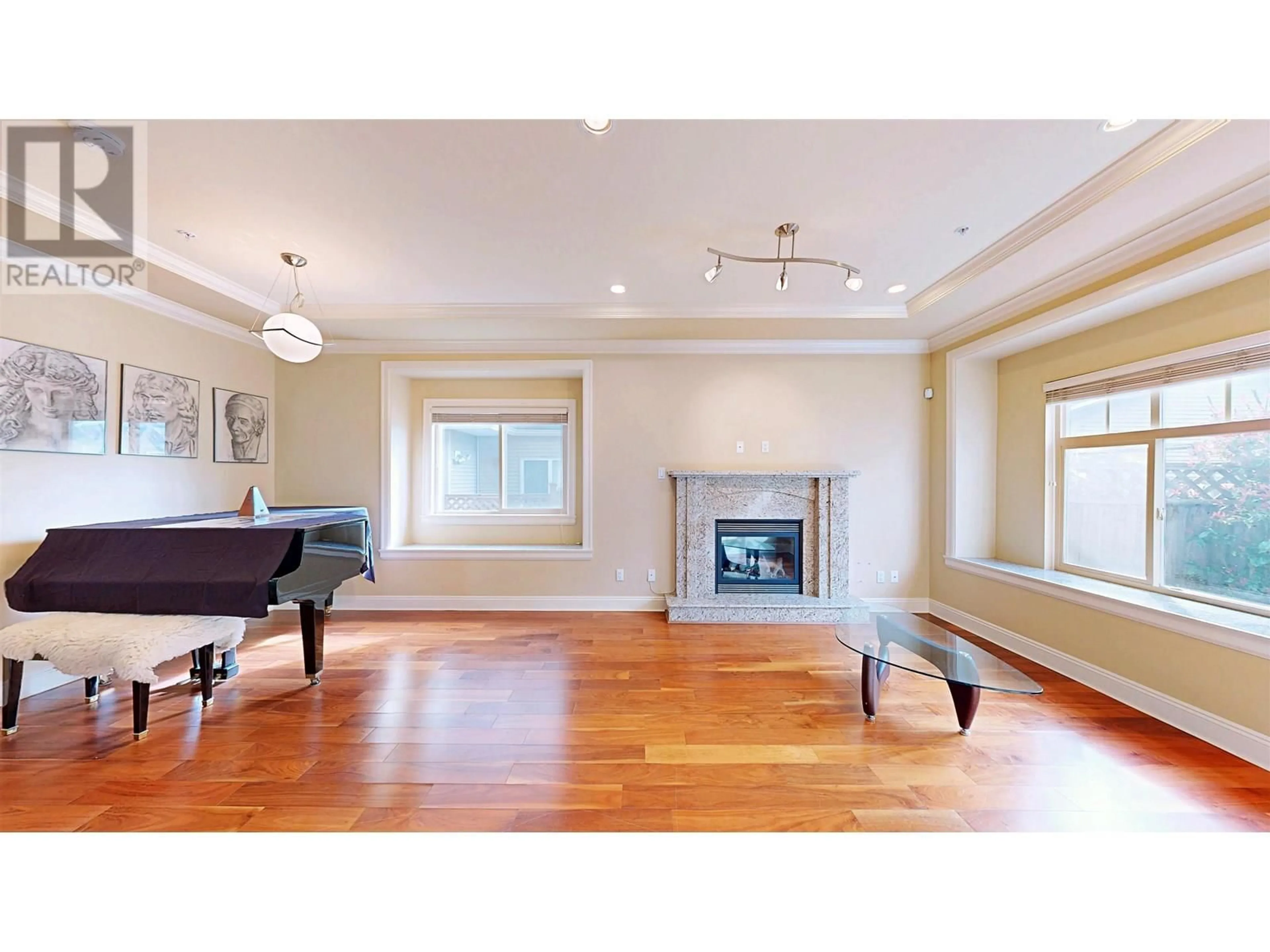 Living room with furniture, wood/laminate floor for 8453 FREMLIN STREET, Vancouver British Columbia V6P3X1