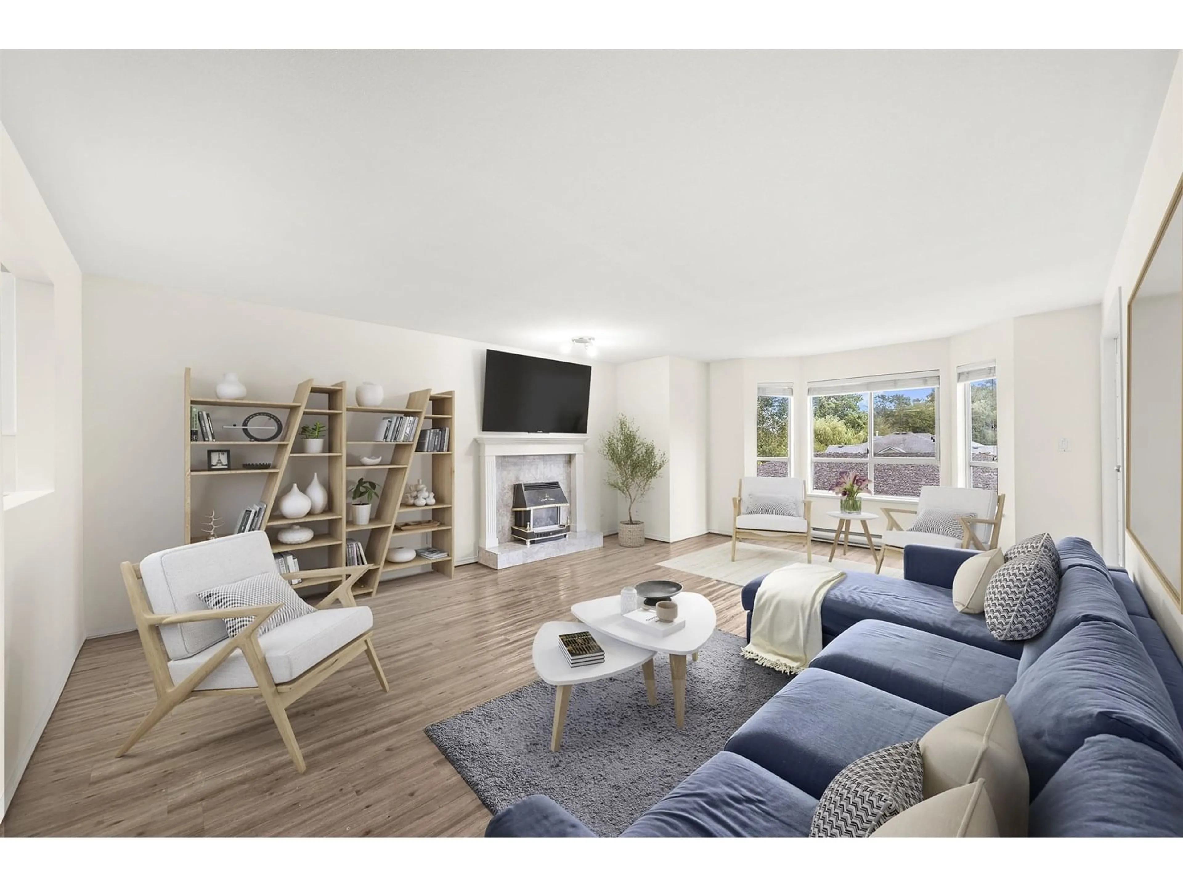 Living room with furniture, wood/laminate floor for 206 - 2440 197, Langley British Columbia V2Y1H9