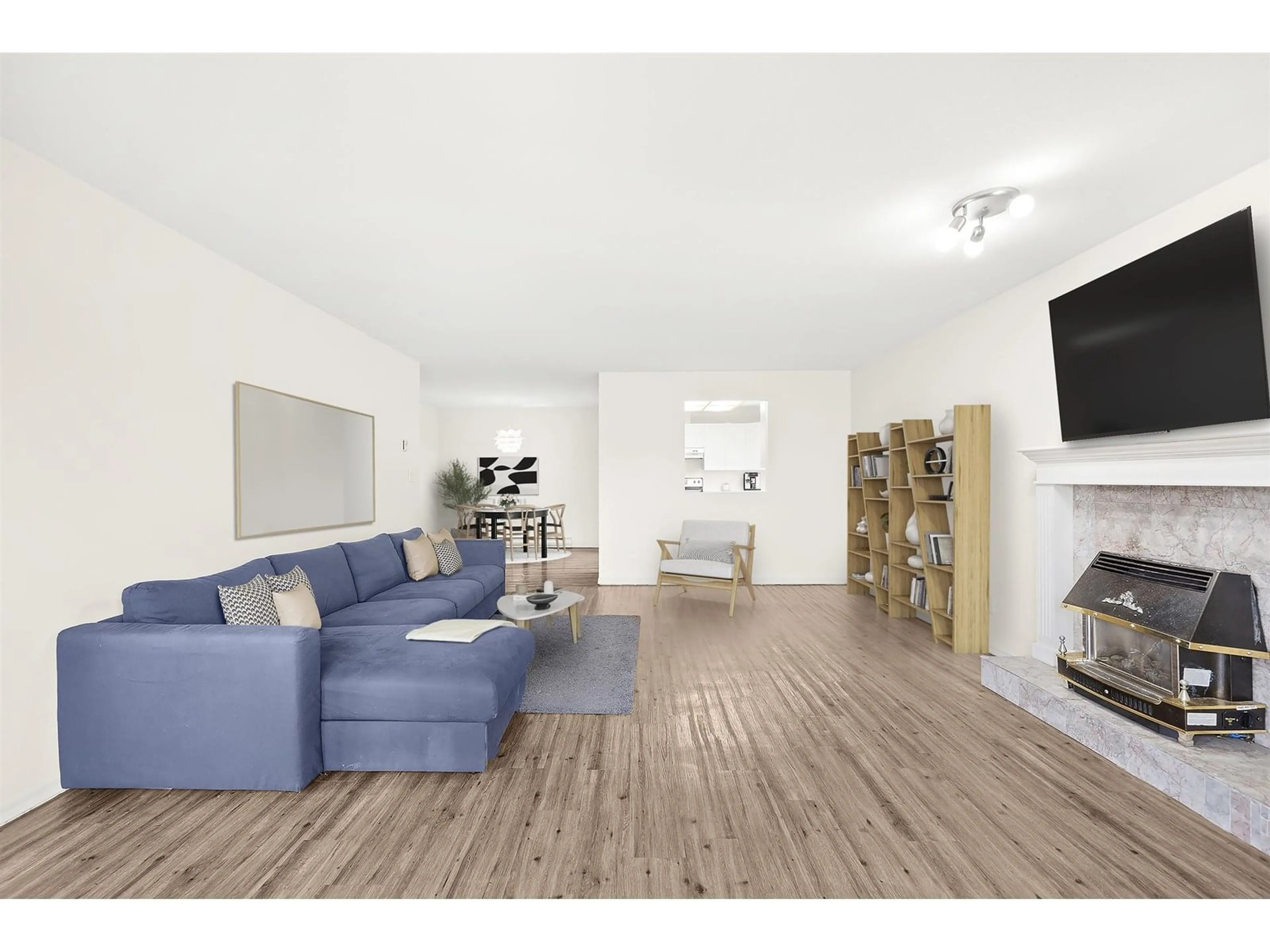 Living room with furniture, wood/laminate floor for 206 - 2440 197, Langley British Columbia V2Y1H9
