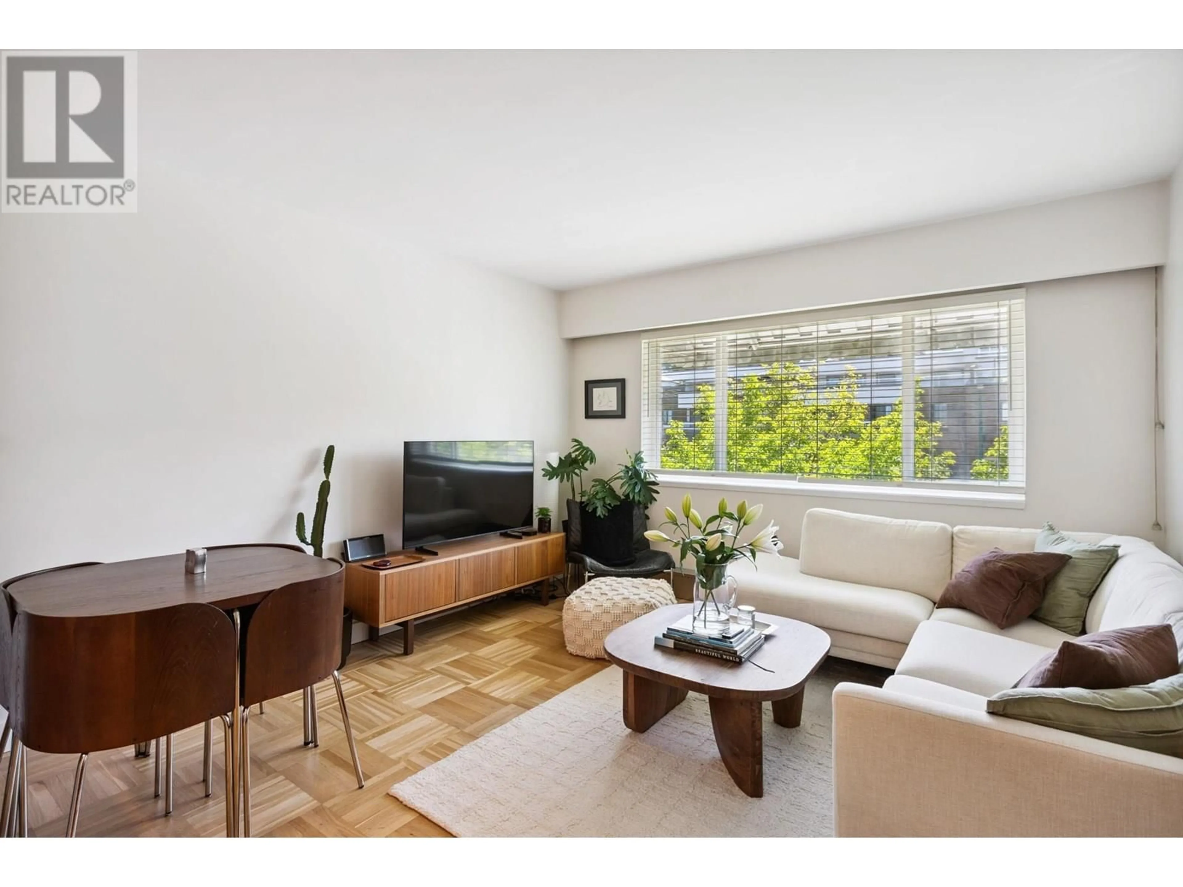 Living room with furniture, wood/laminate floor for 303 - 2469 CORNWALL AVENUE, Vancouver British Columbia V6K1B9