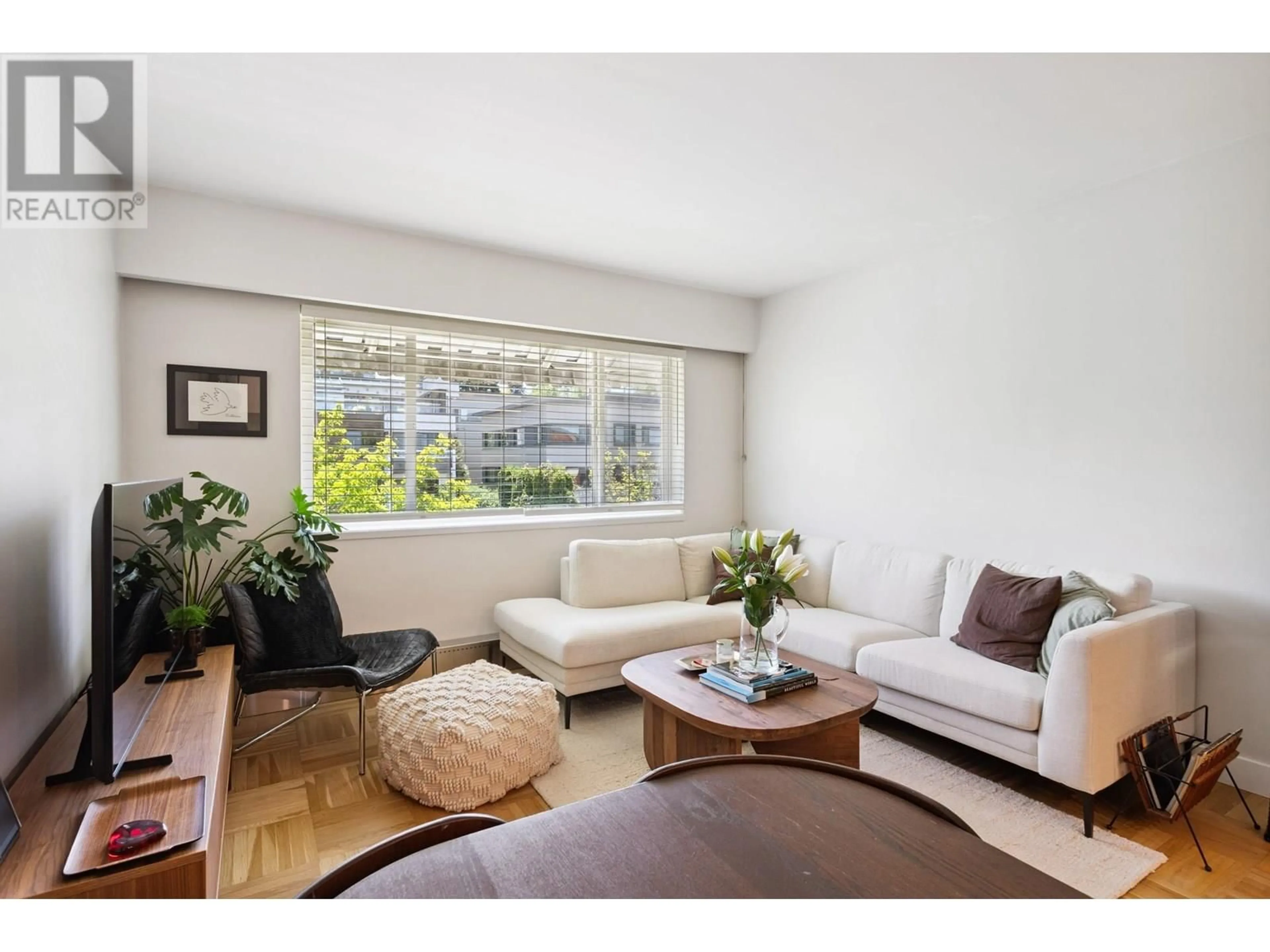 Living room with furniture, wood/laminate floor for 303 - 2469 CORNWALL AVENUE, Vancouver British Columbia V6K1B9
