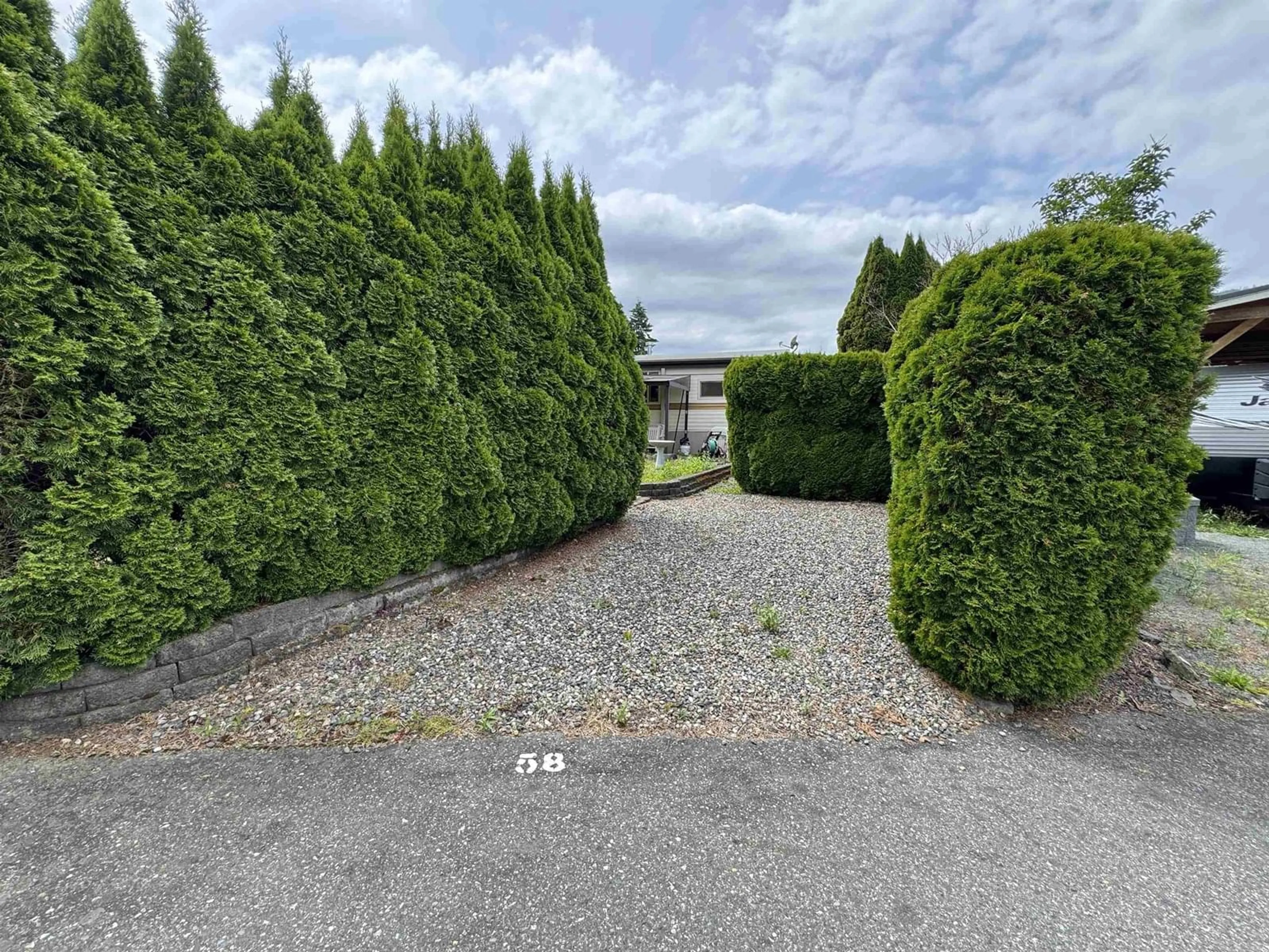 A pic from outside/outdoor area/front of a property/back of a property/a pic from drone, street for 58 - 1436 FROST ROAD, Cultus Lake British Columbia V2R4X8