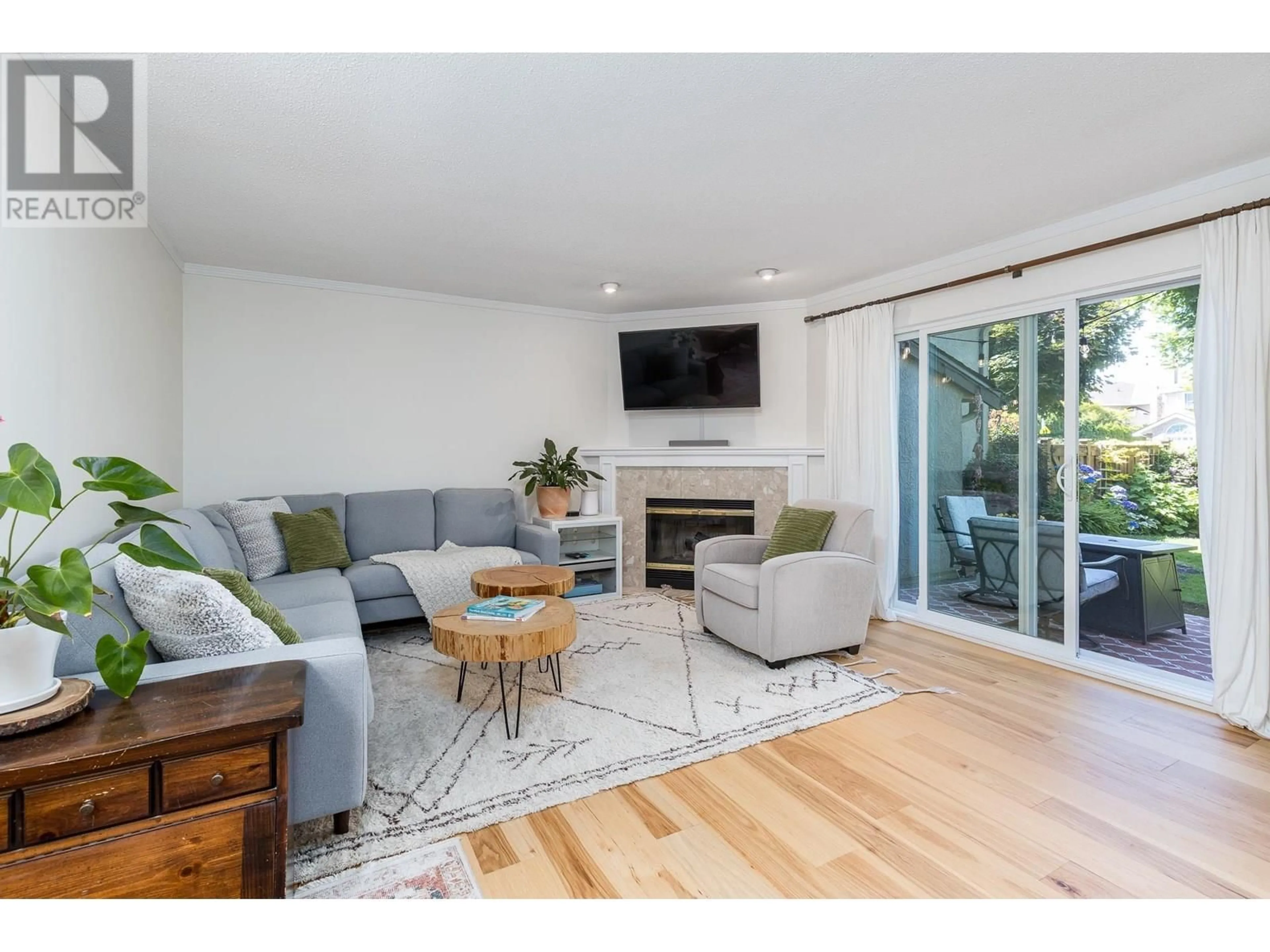 Living room with furniture, wood/laminate floor for 25 - 12438 BRUNSWICK PLACE, Richmond British Columbia V7E6K6