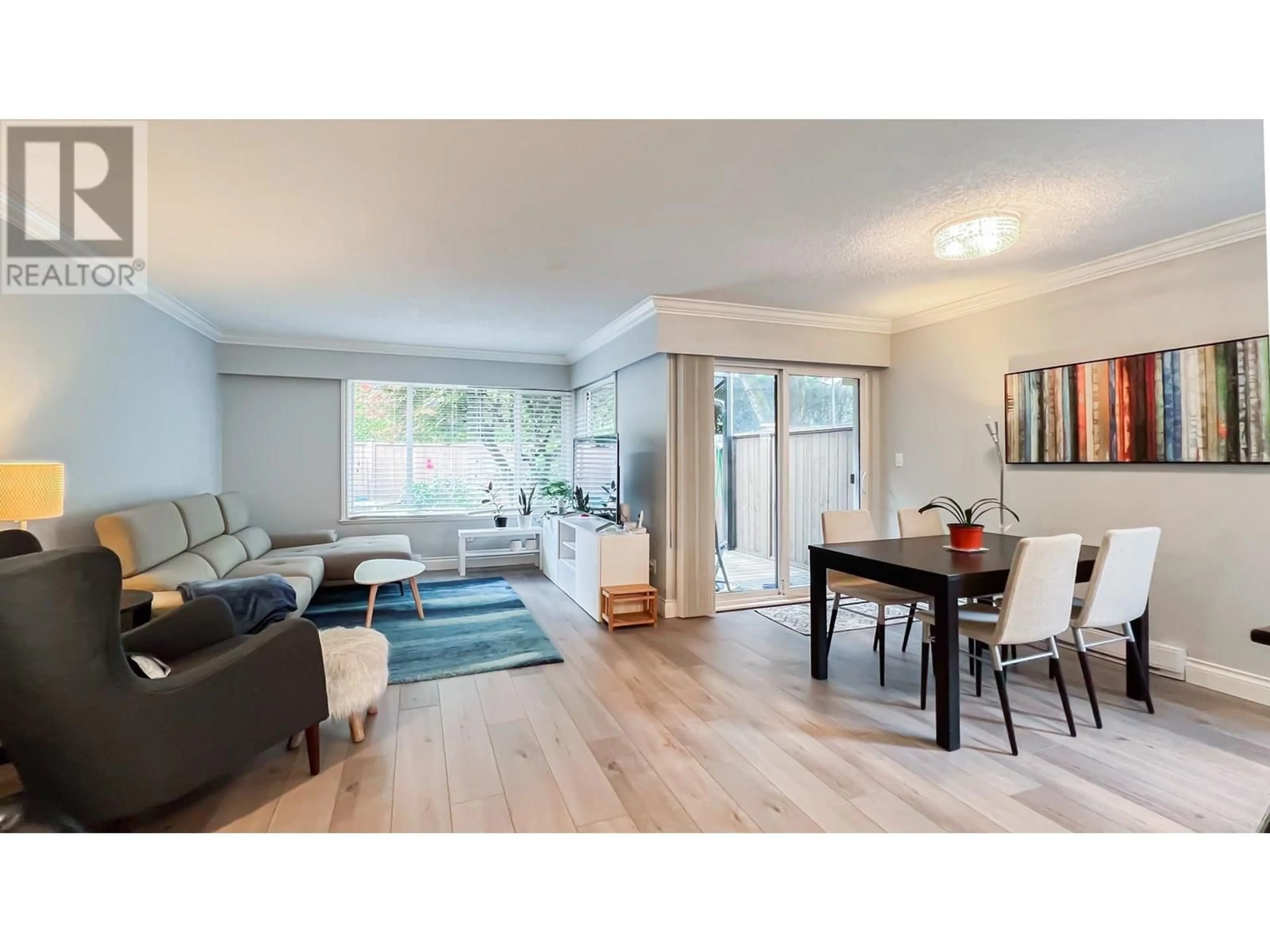Living room with furniture, wood/laminate floor for 34 - 9111 NO. 5 ROAD, Richmond British Columbia V7A4N3