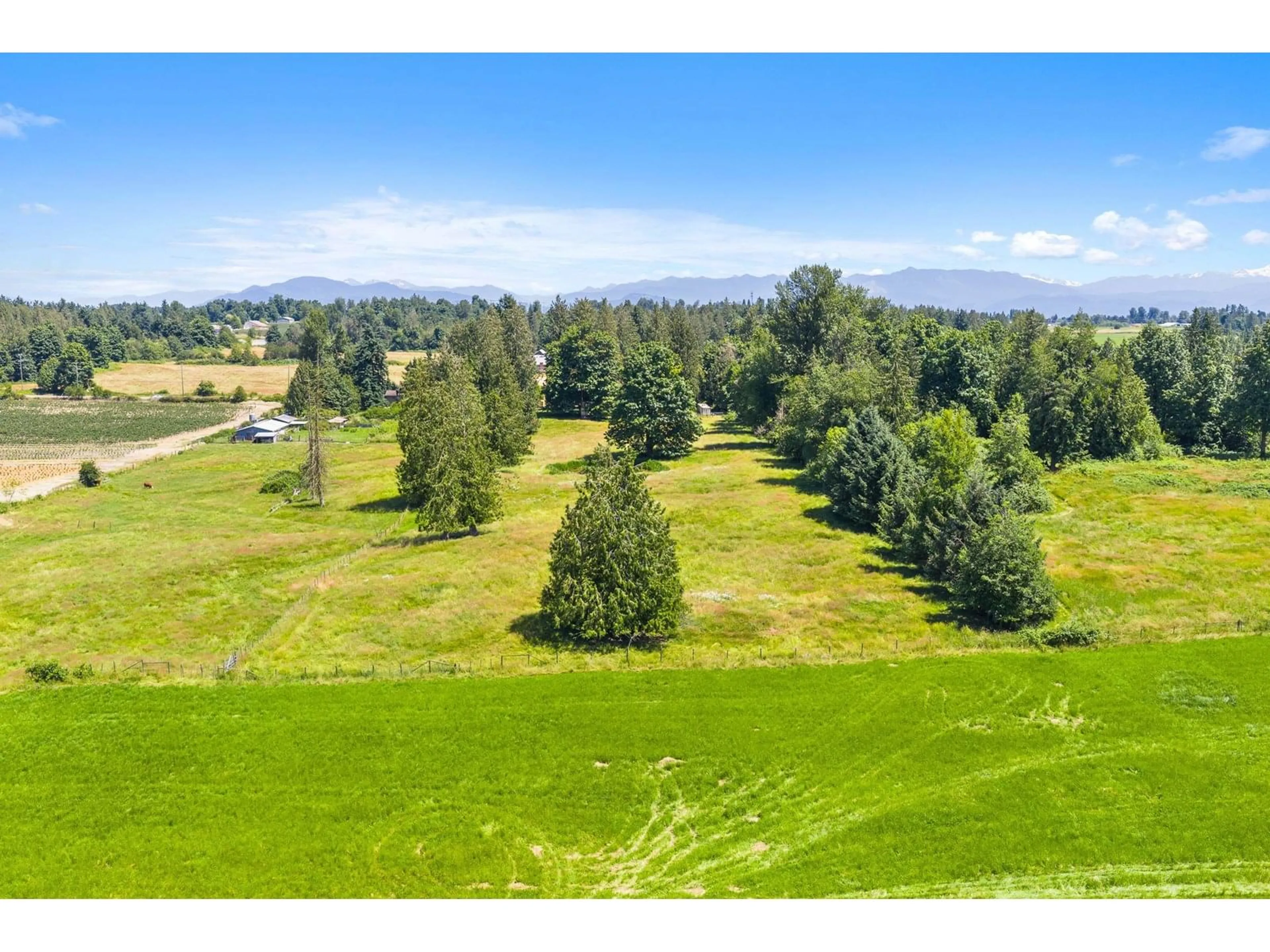 A pic from outside/outdoor area/front of a property/back of a property/a pic from drone, mountain view for 3759 BRADNER, Abbotsford British Columbia V4X1M9
