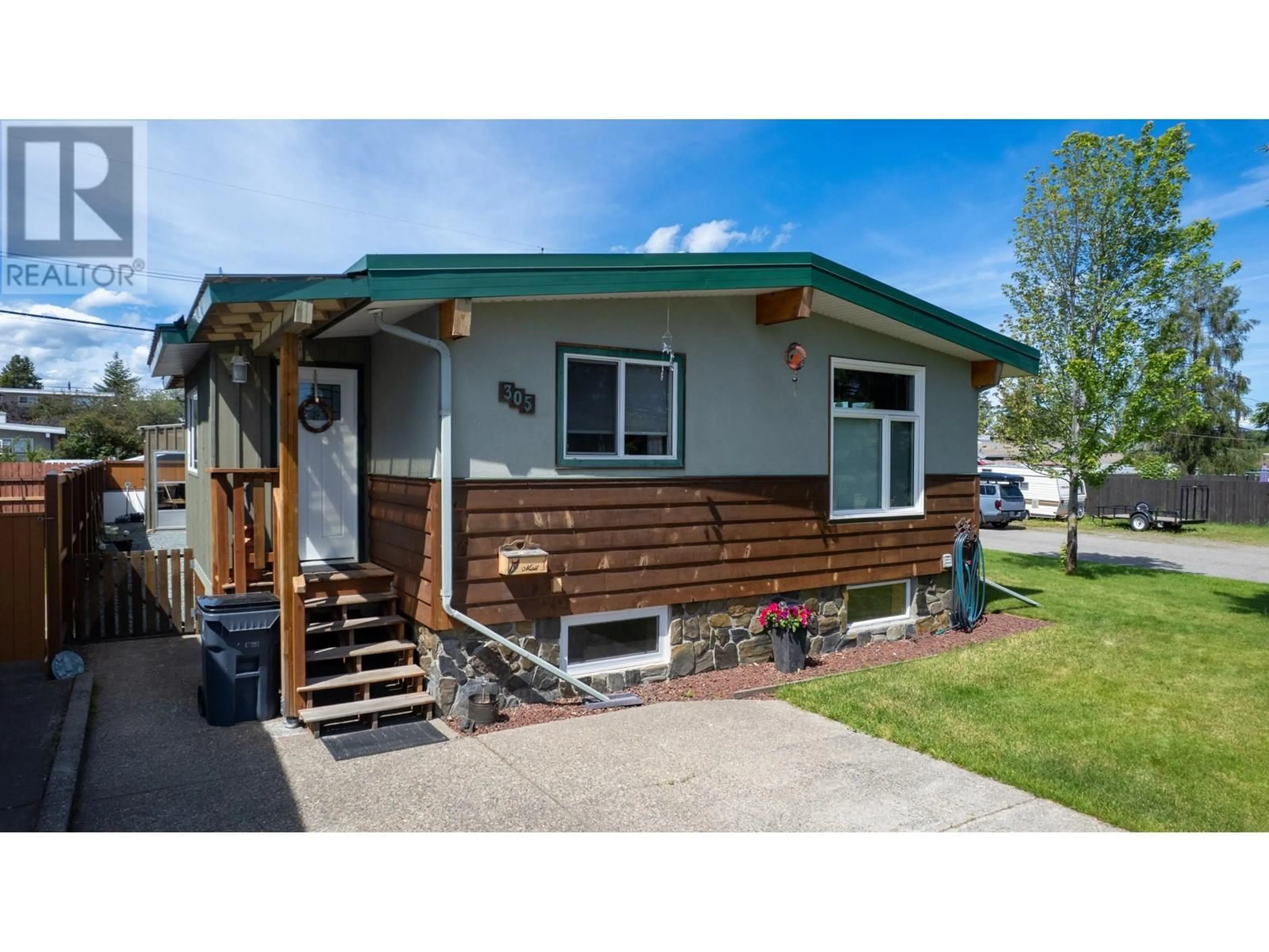 Home with vinyl exterior material, street for 305 KELLY STREET, Prince George British Columbia V2M3K4