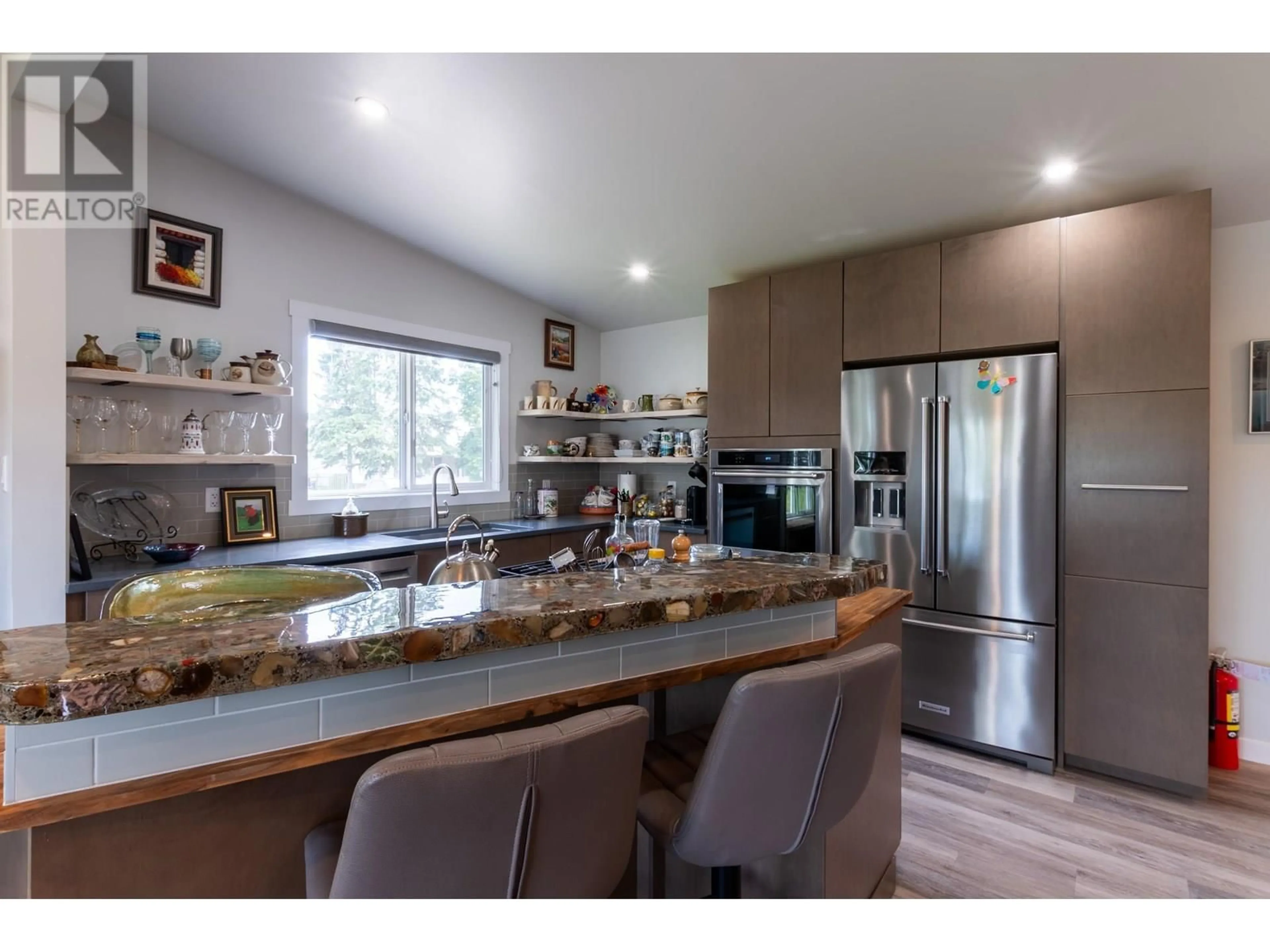 Open concept kitchen, wood/laminate floor for 305 KELLY STREET, Prince George British Columbia V2M3K4