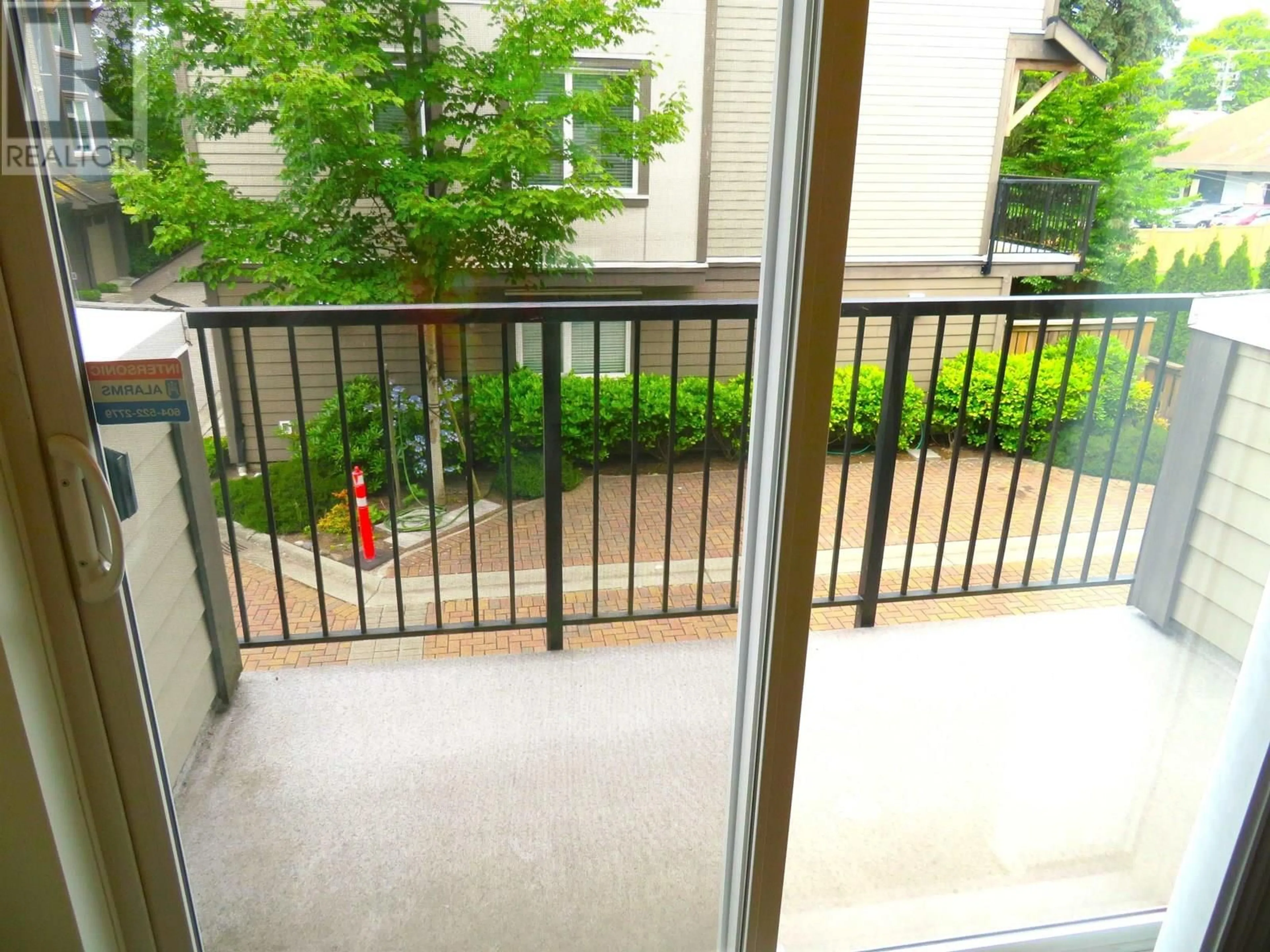 Balcony in the apartment, city buildings view from balcony for 10 - 4099 NO. 4 ROAD, Richmond British Columbia V6X2M2