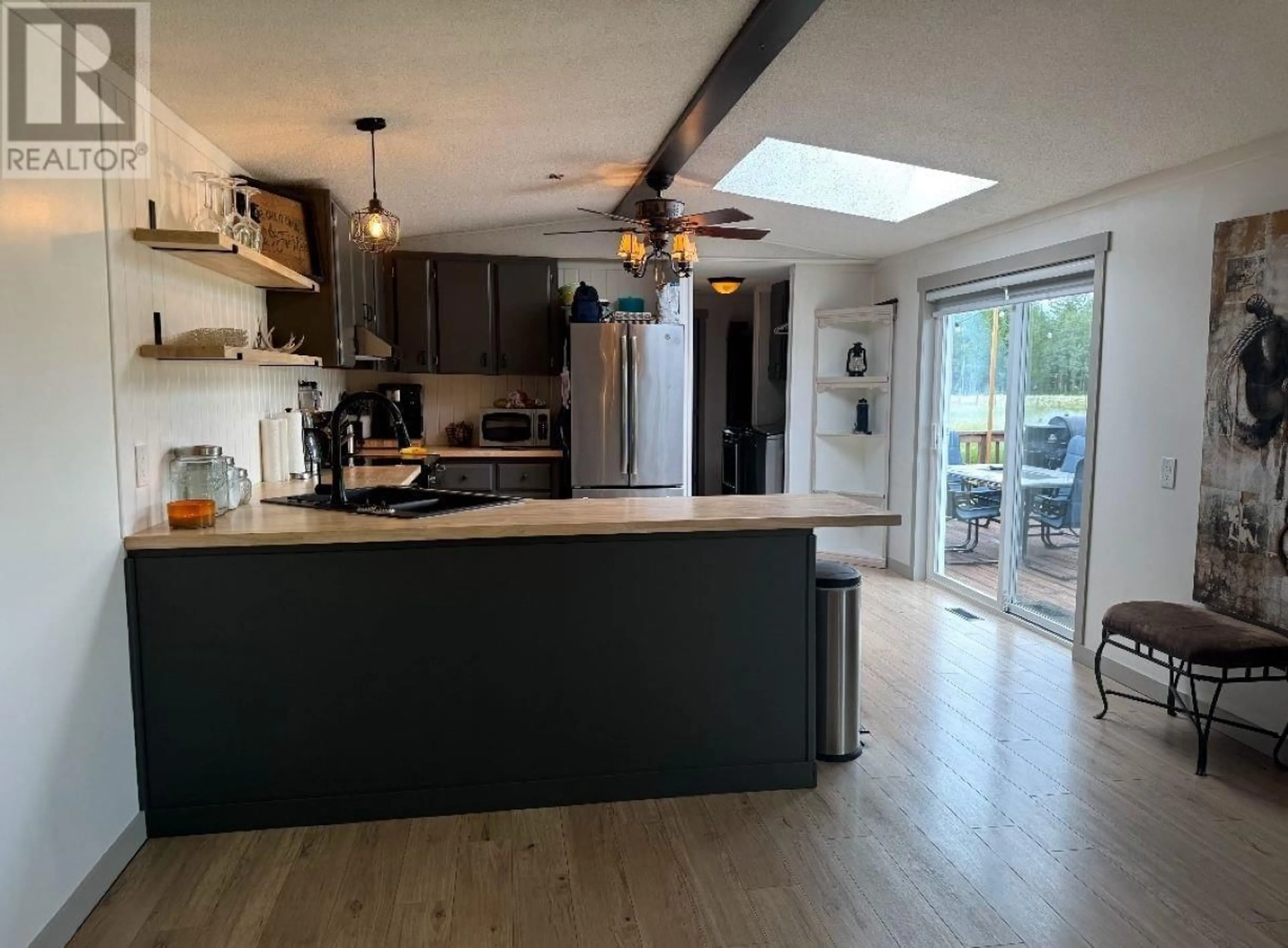 Open concept kitchen, wood/laminate floor for 6110 LAMBERTUS ROAD, Prince George British Columbia V2K5L8