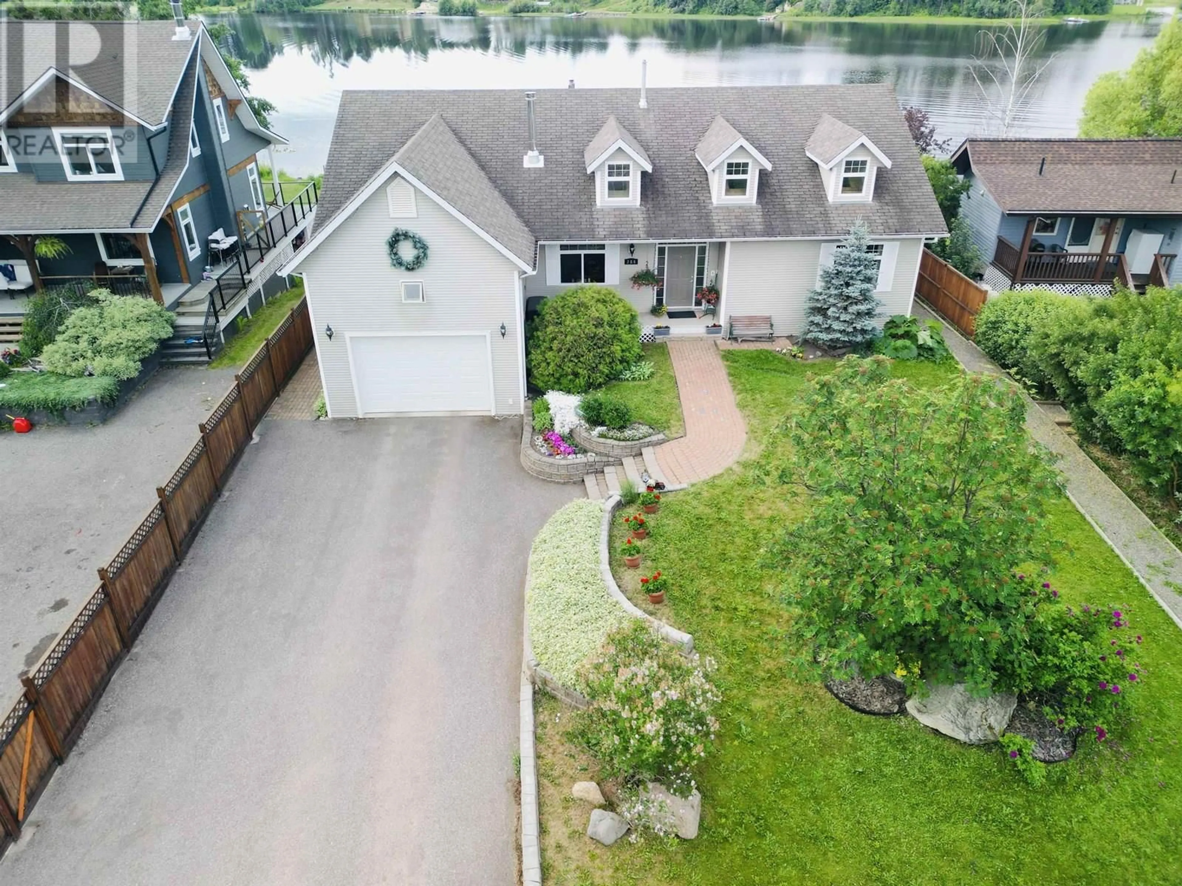 A pic from outside/outdoor area/front of a property/back of a property/a pic from drone, water/lake/river/ocean view for 286 PIONEER WAY, Burns Lake British Columbia V0J1E0