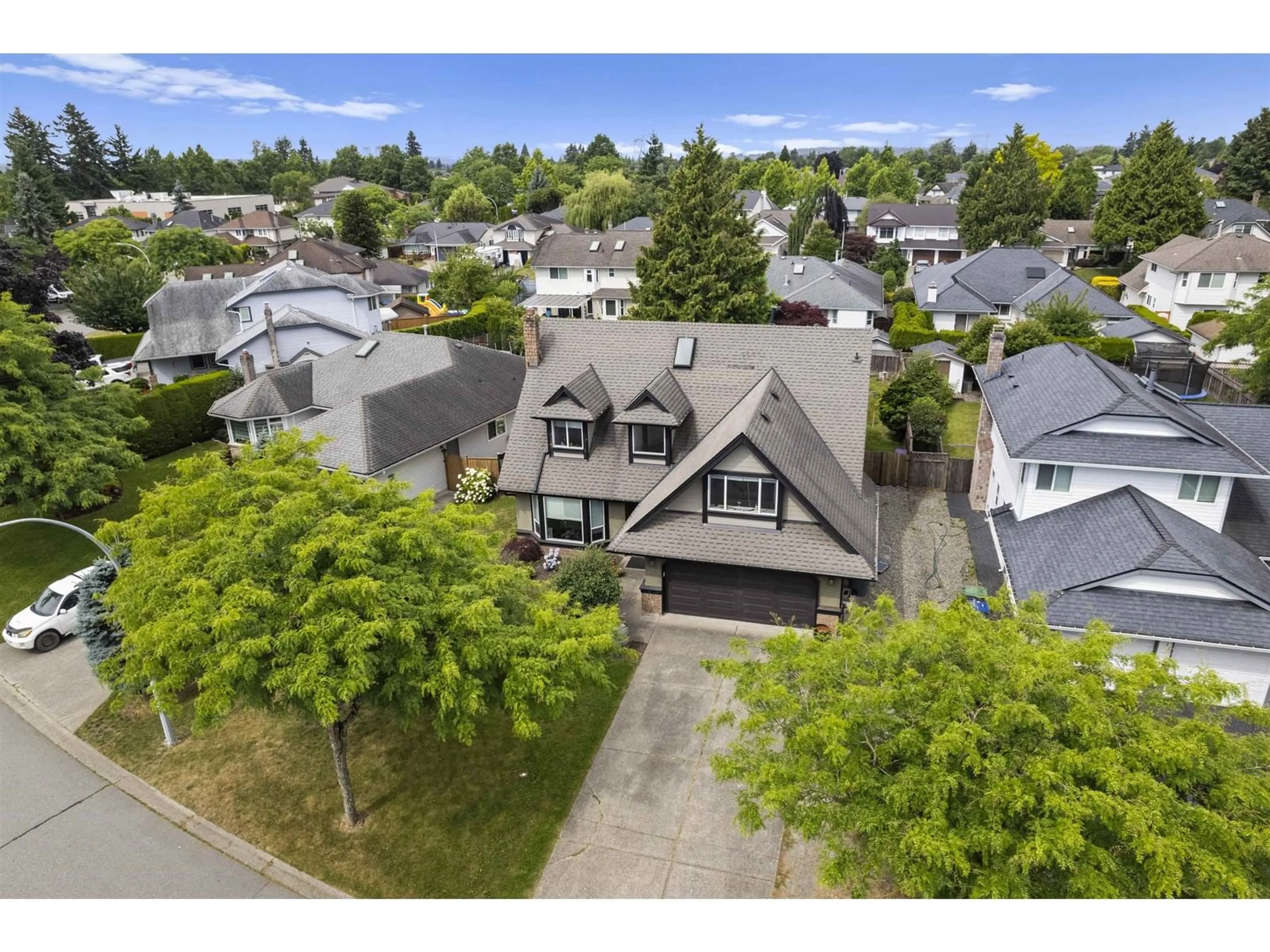 A pic from outside/outdoor area/front of a property/back of a property/a pic from drone, street for 6105 187A, Surrey British Columbia V3S7R5