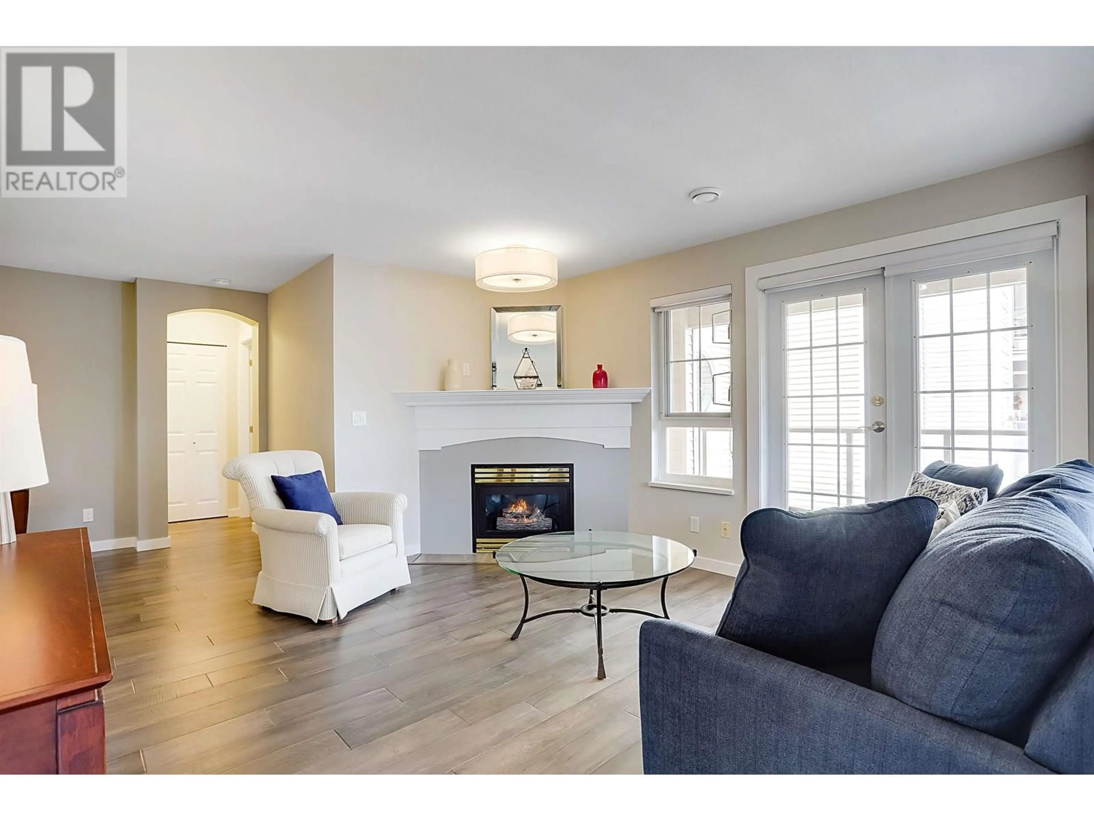 Living room with furniture, wood/laminate floor for 313 - 5500 ANDREWS ROAD, Richmond British Columbia V7E6M9