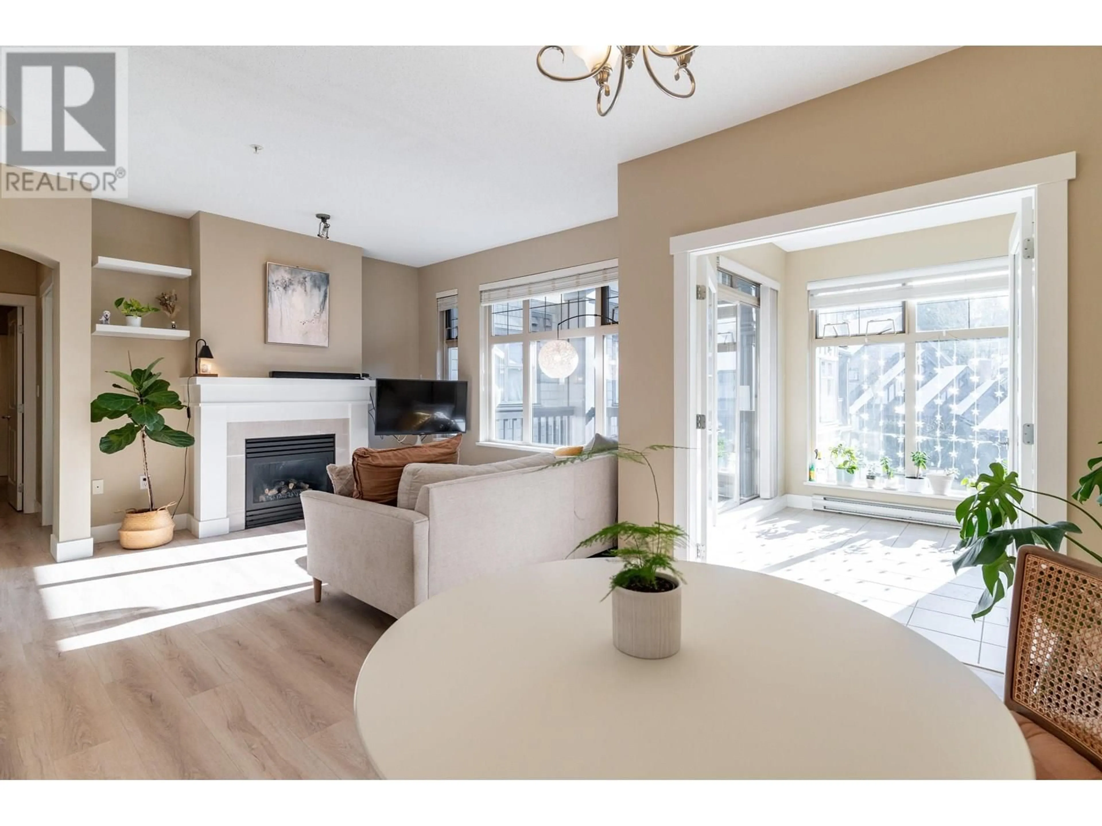 Living room with furniture, wood/laminate floor for 301 - 4885 VALLEY DRIVE, Vancouver British Columbia V6J5M7