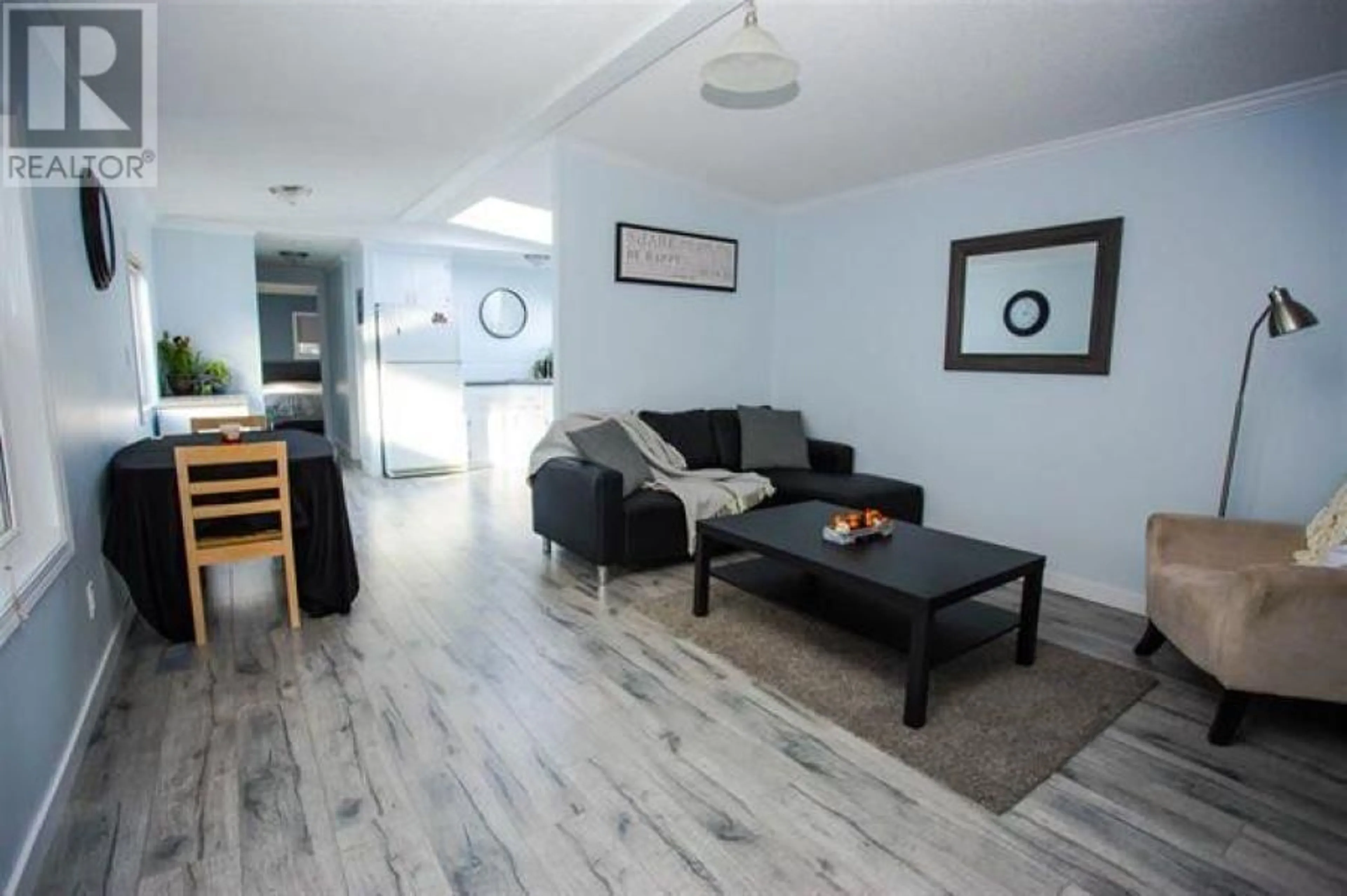 Living room with furniture, wood/laminate floor for 98 - 1000 INVERNESS ROAD, Prince George British Columbia V2K4V1