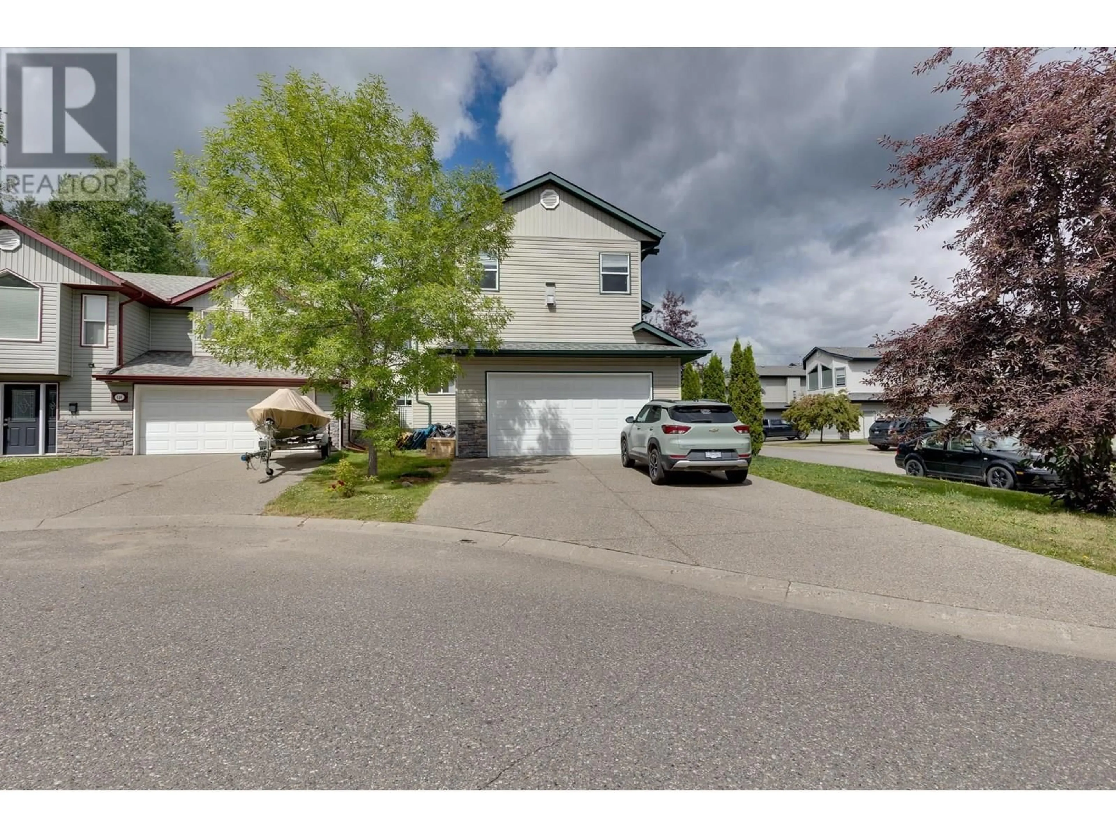 A pic from outside/outdoor area/front of a property/back of a property/a pic from drone, street for 115 - 1299 OSPIKA BOULEVARD, Prince George British Columbia V2M7G2