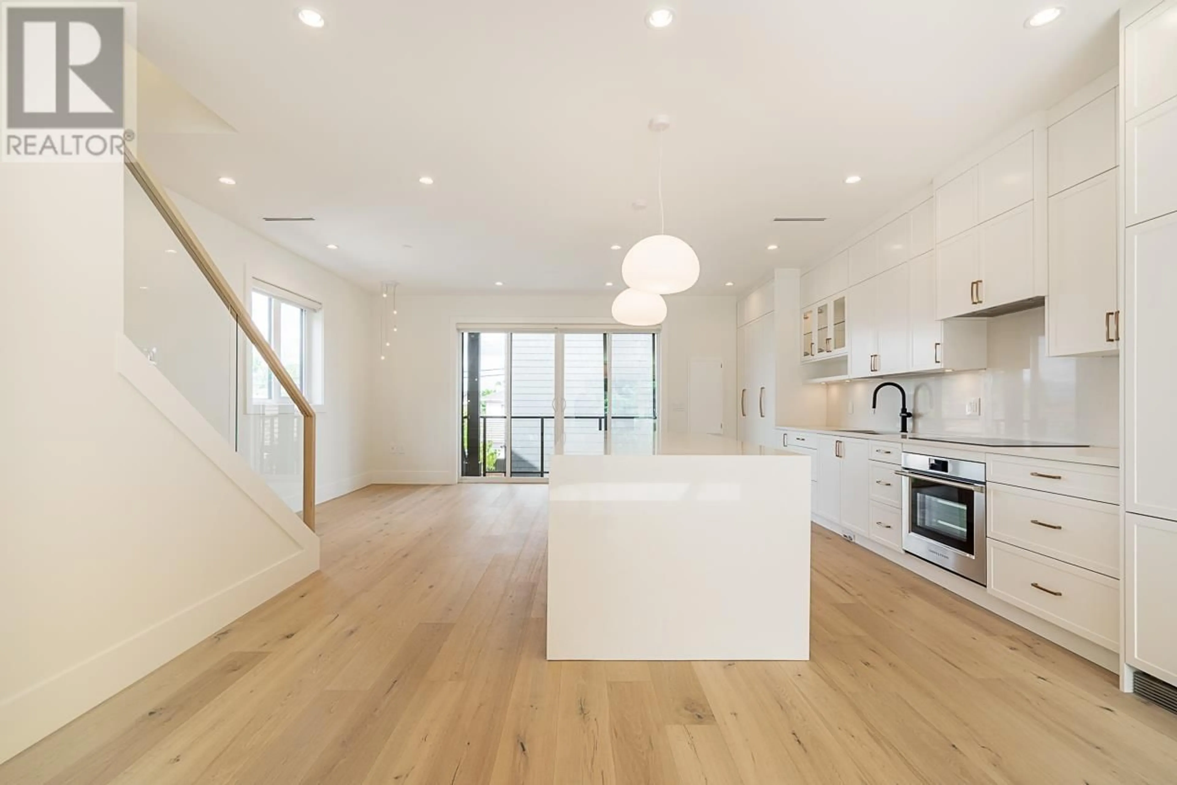 Open concept kitchen, wood/laminate floor for 45 15TH AVENUE, Vancouver British Columbia V5Y1X7