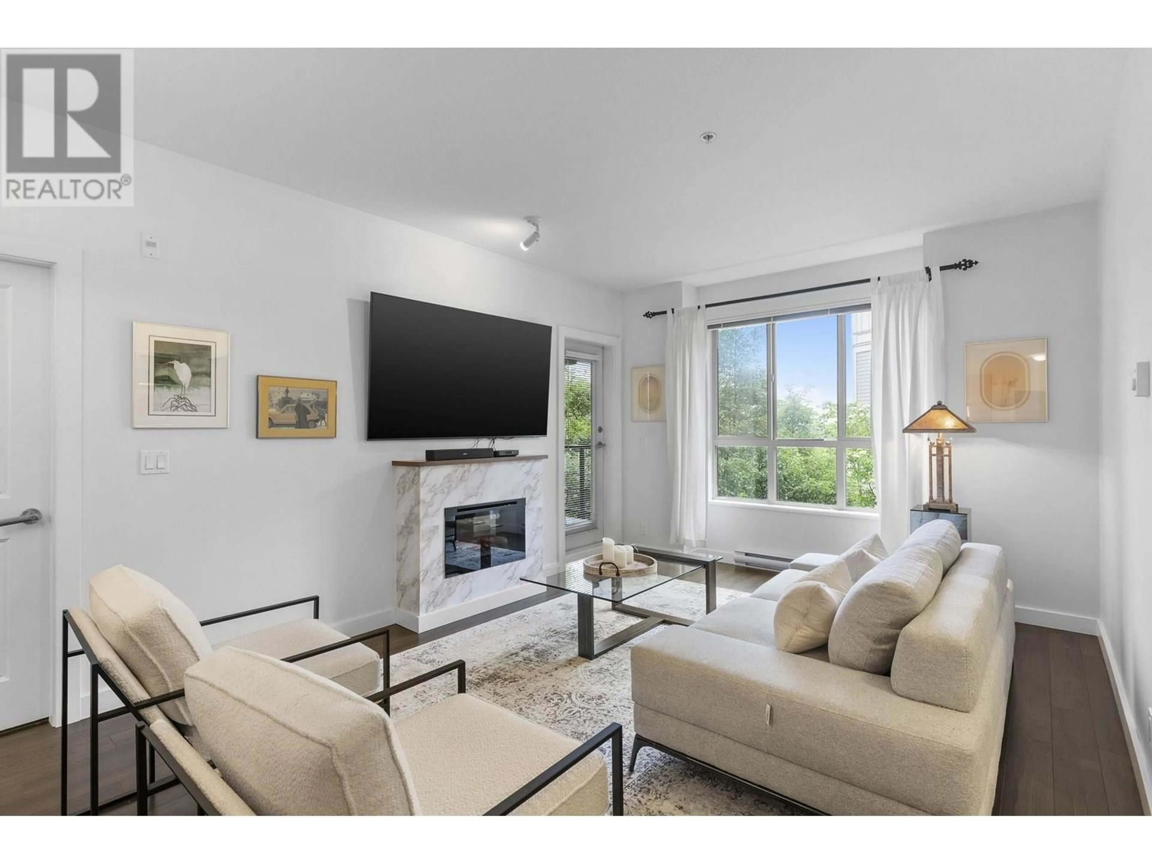 Living room with furniture, unknown for 202 - 250 FRANCIS WAY, New Westminster British Columbia V3L0E6