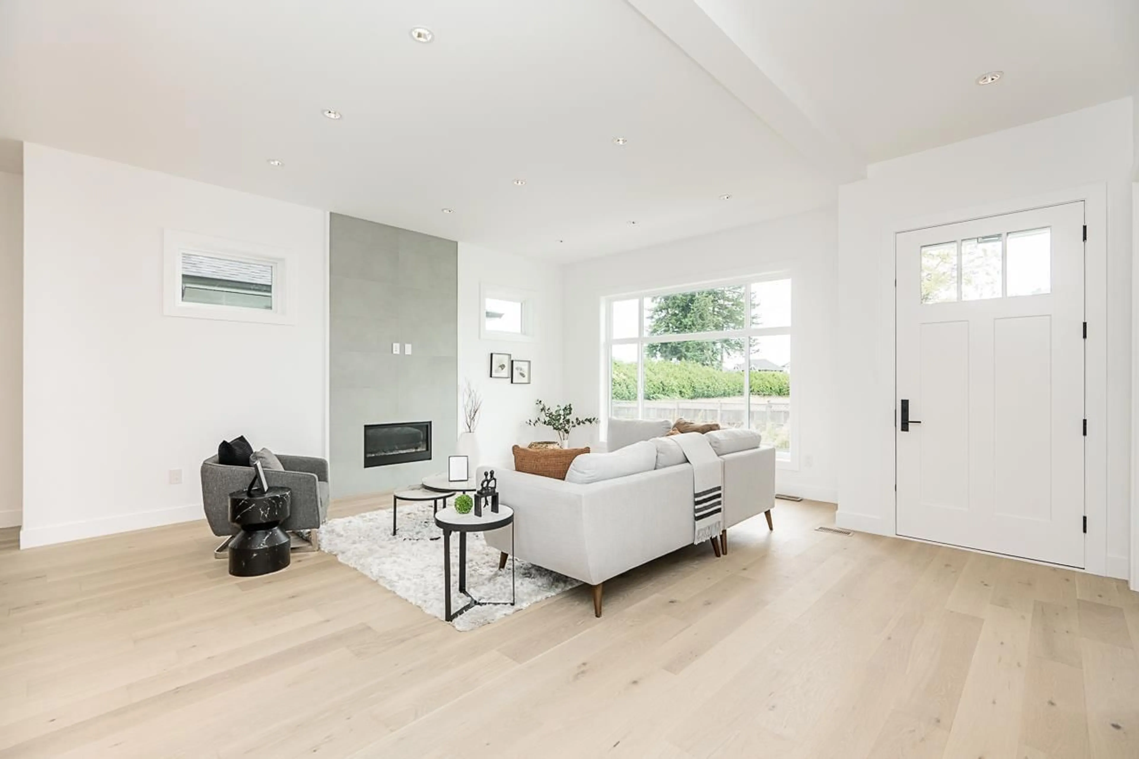 Living room with furniture, wood/laminate floor for 1938 167A, Surrey British Columbia V3Z1K2