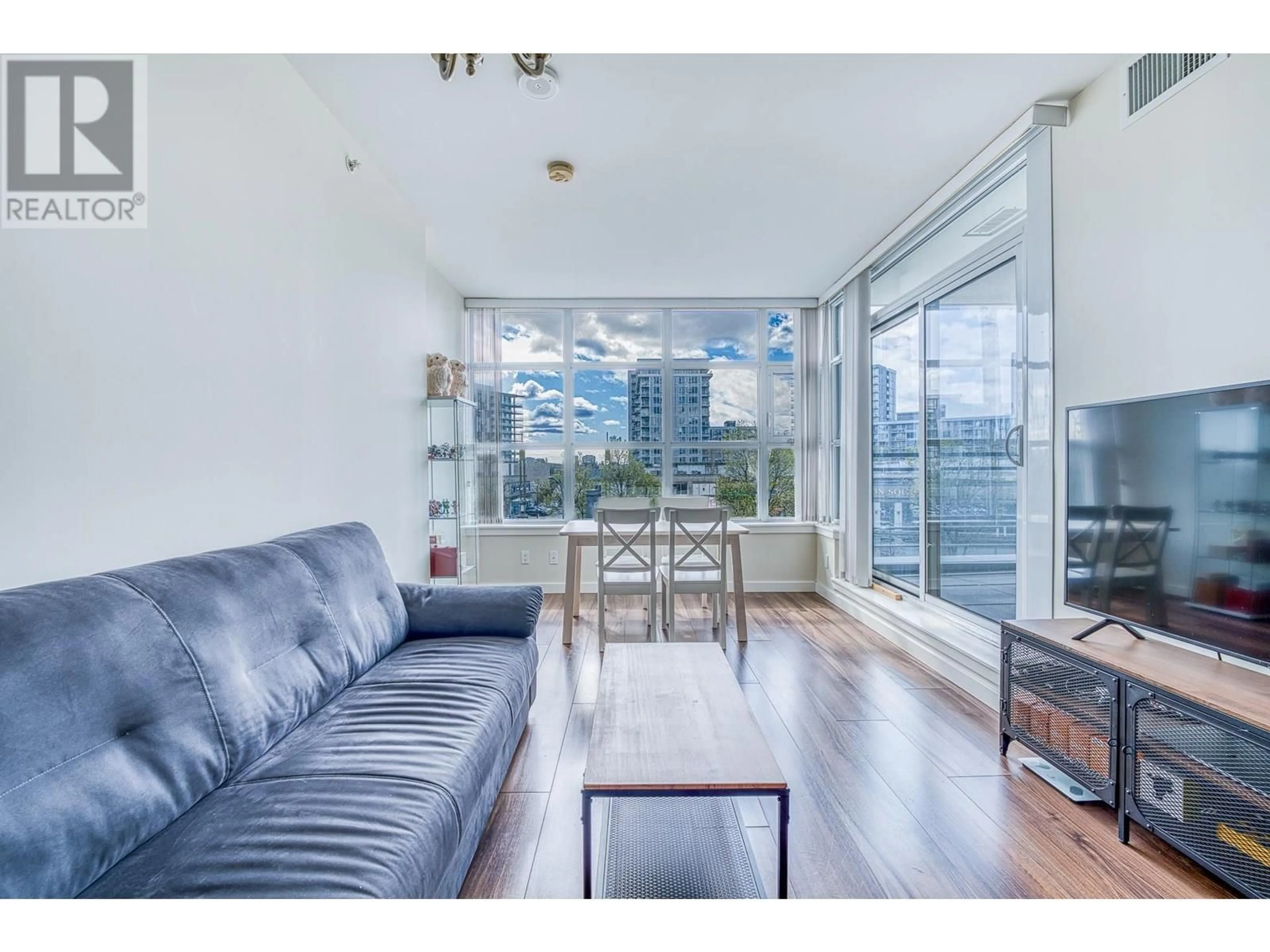 Living room with furniture, wood/laminate floor for 305 - 8633 CAPSTAN WAY, Richmond British Columbia V6X0N5