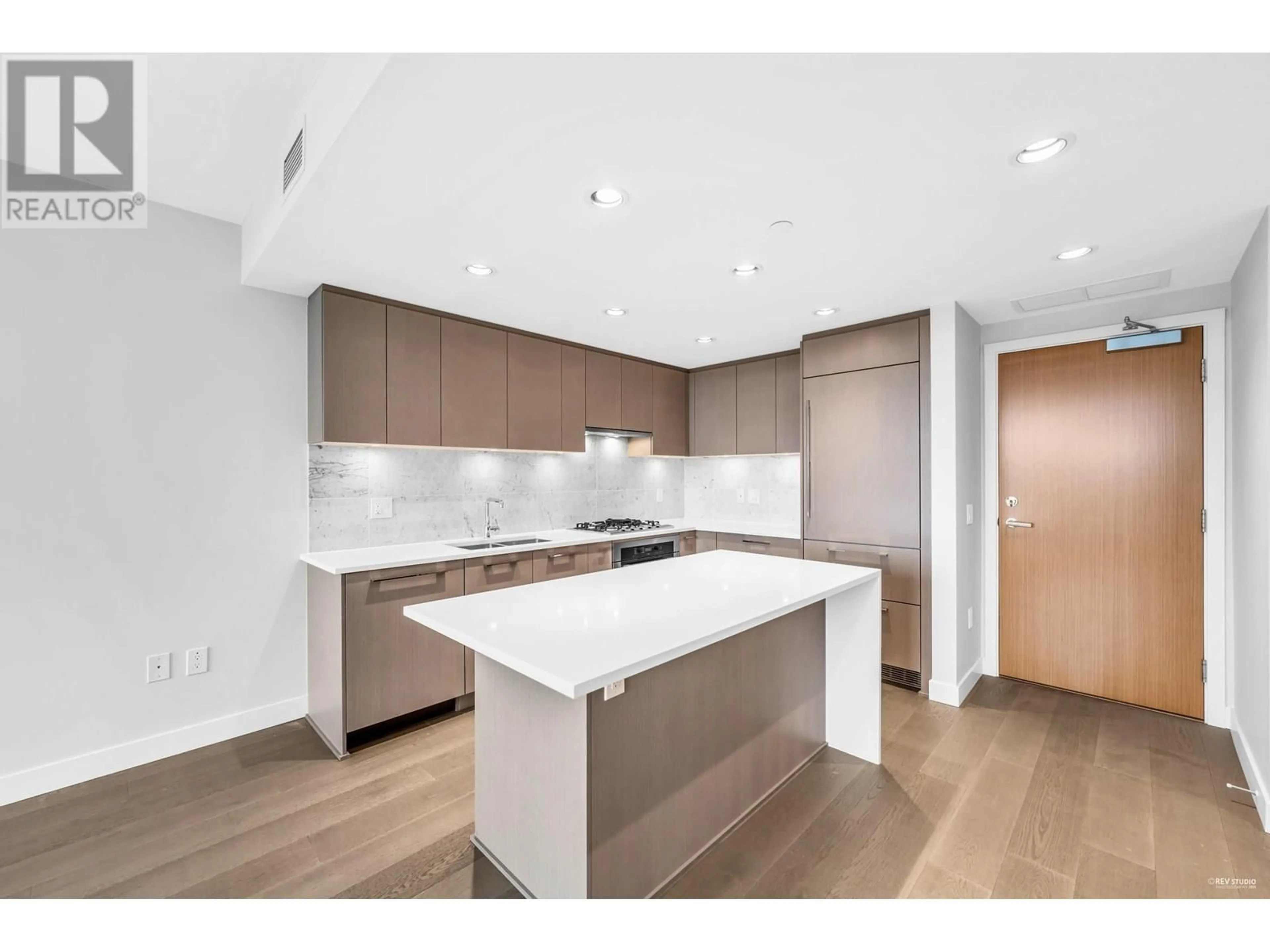Open concept kitchen, wood/laminate floor for 1107 - 5410 SHORTCUT ROAD, Vancouver British Columbia V6T0C8