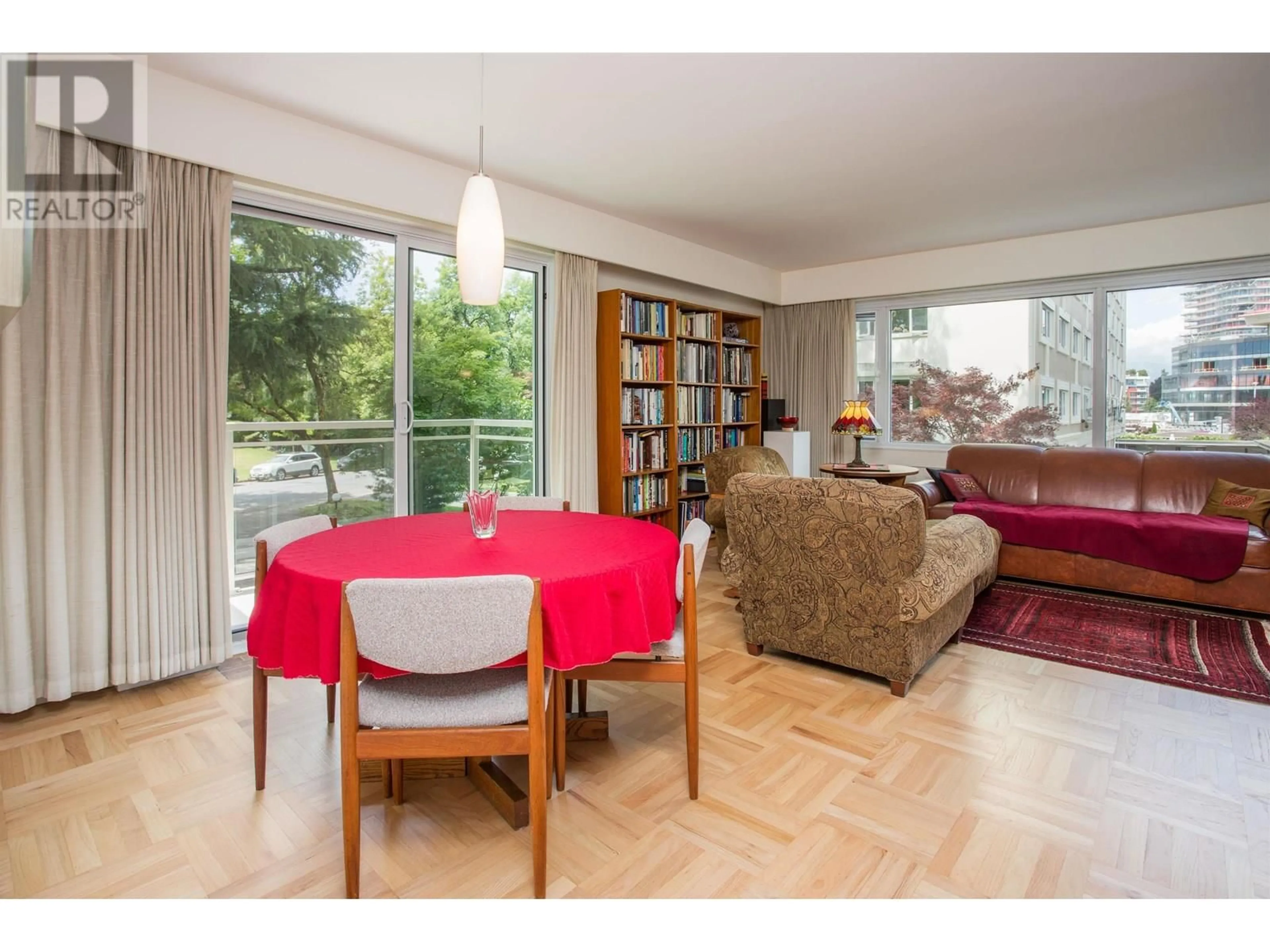 Living room with furniture, wood/laminate floor for 101 - 6076 TISDALL STREET, Vancouver British Columbia V5Z3N2