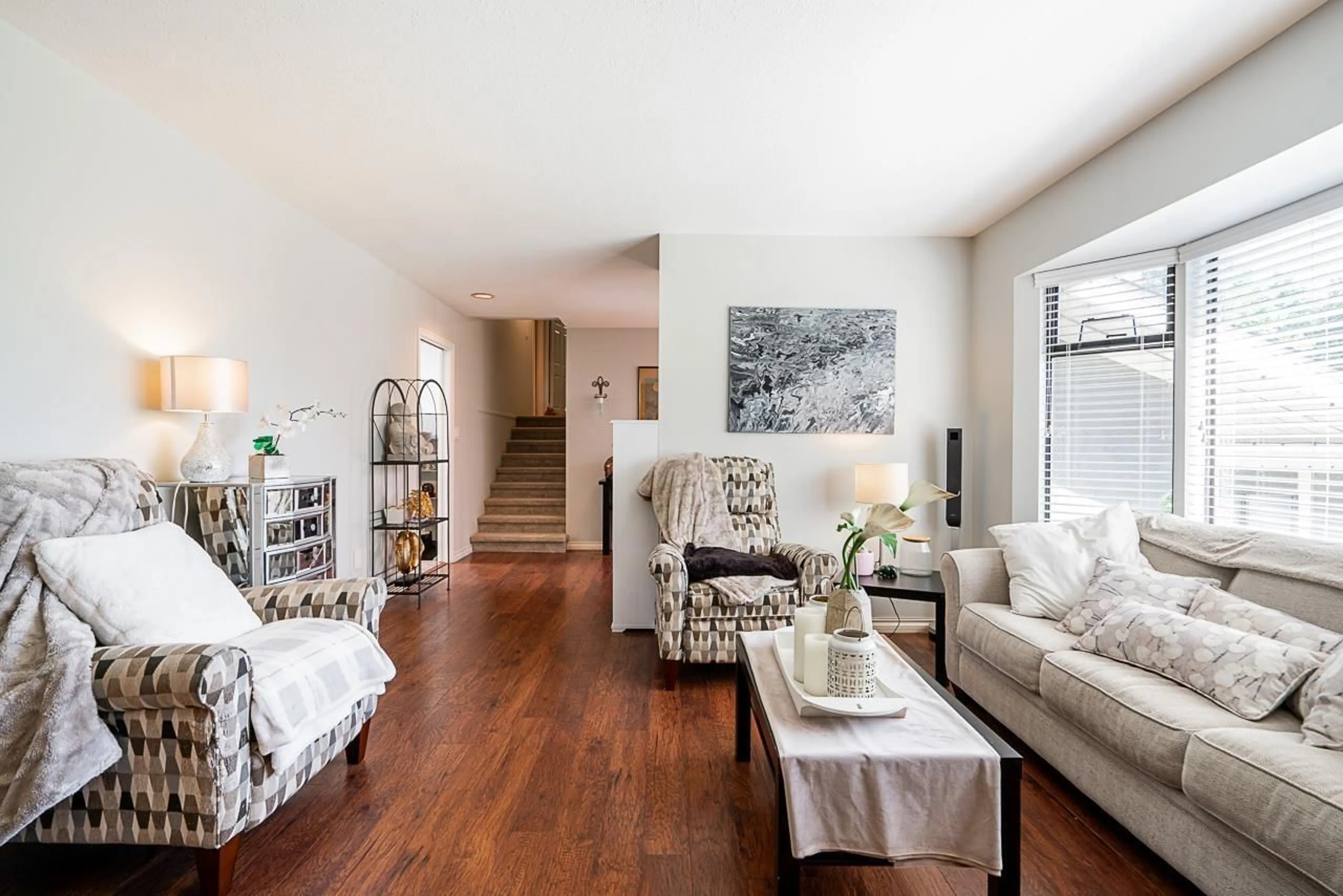 Living room with furniture, wood/laminate floor for 14449 19A, Surrey British Columbia V4A6X3