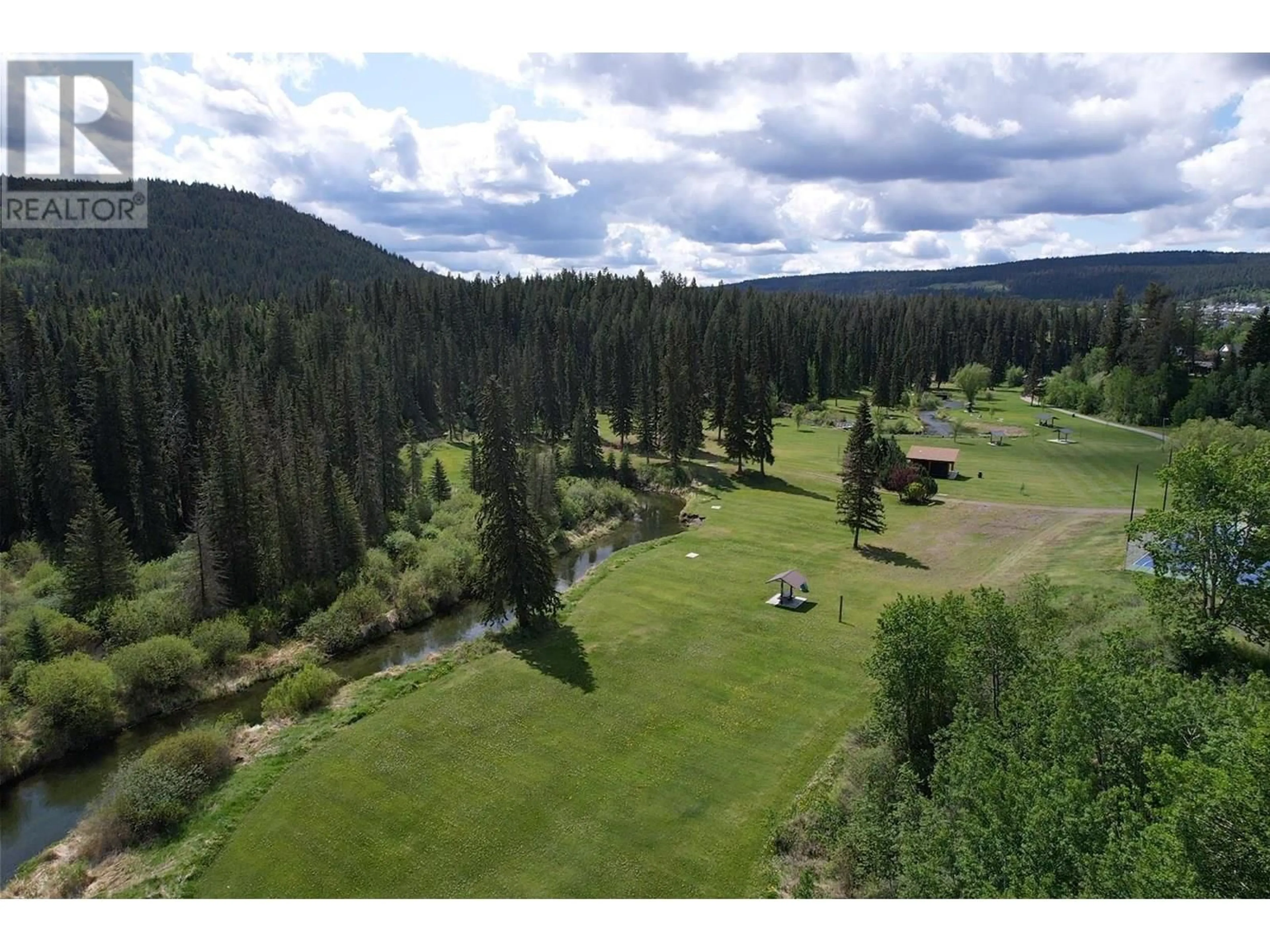 A pic from outside/outdoor area/front of a property/back of a property/a pic from drone, forest/trees view for 145 EVERGREEN CRESCENT, 100 Mile House British Columbia V0K2E0