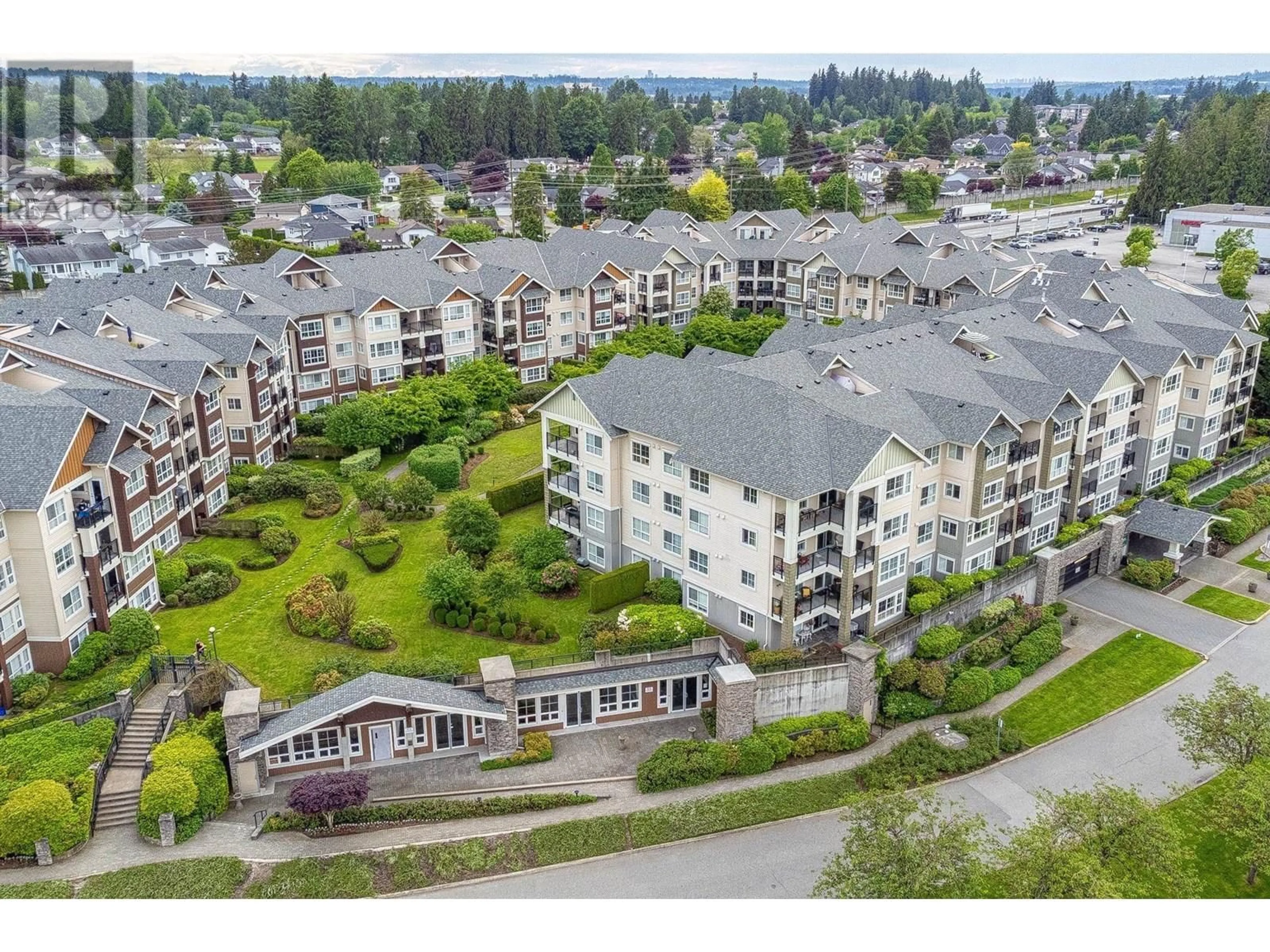 A pic from outside/outdoor area/front of a property/back of a property/a pic from drone, mountain view for 416 - 19673 MEADOW GARDENS WAY, Pitt Meadows British Columbia V3Y0A1