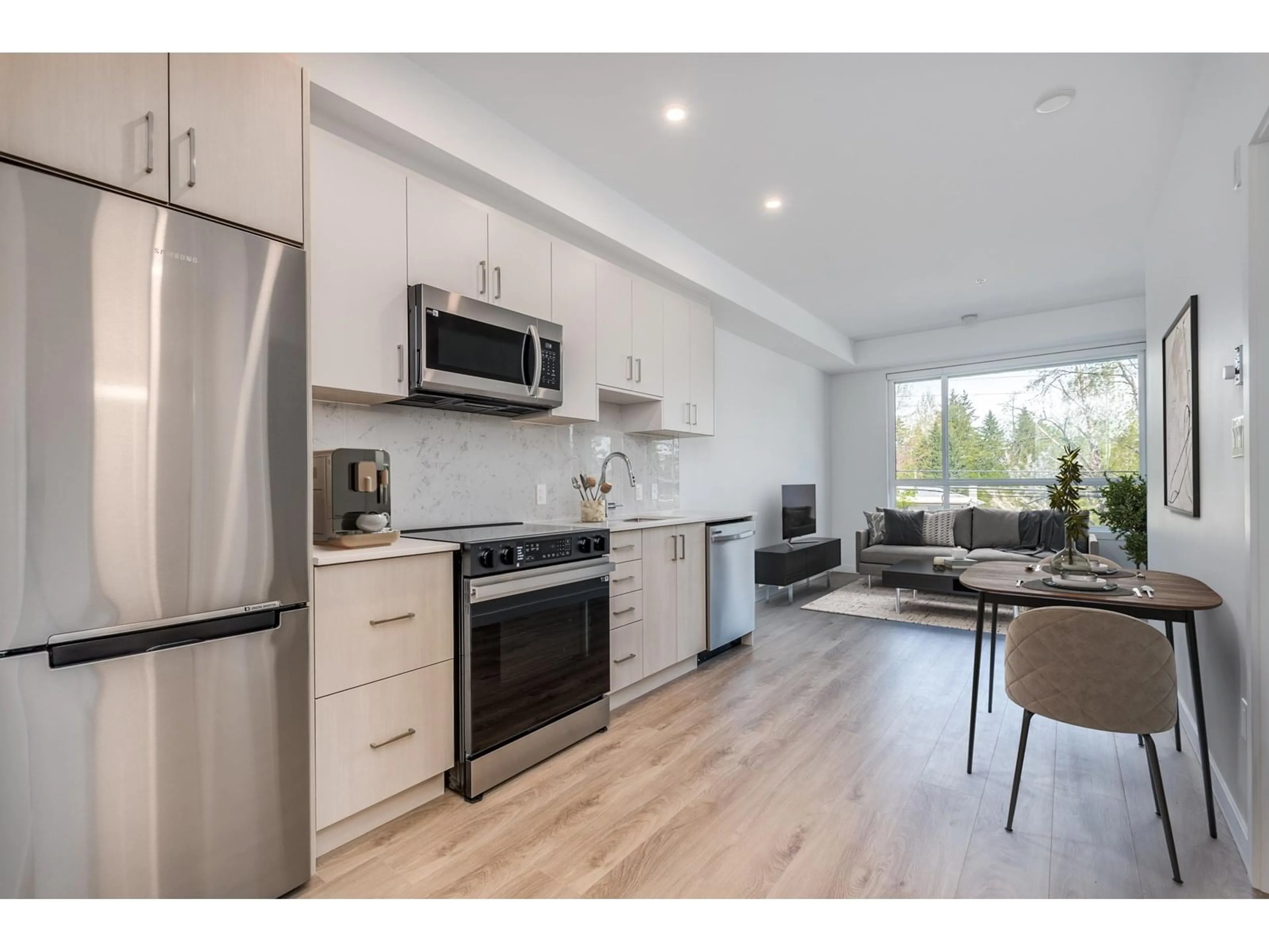 Open concept kitchen, wood/laminate floor for E216 - 13858 108, Surrey British Columbia V3T0T8