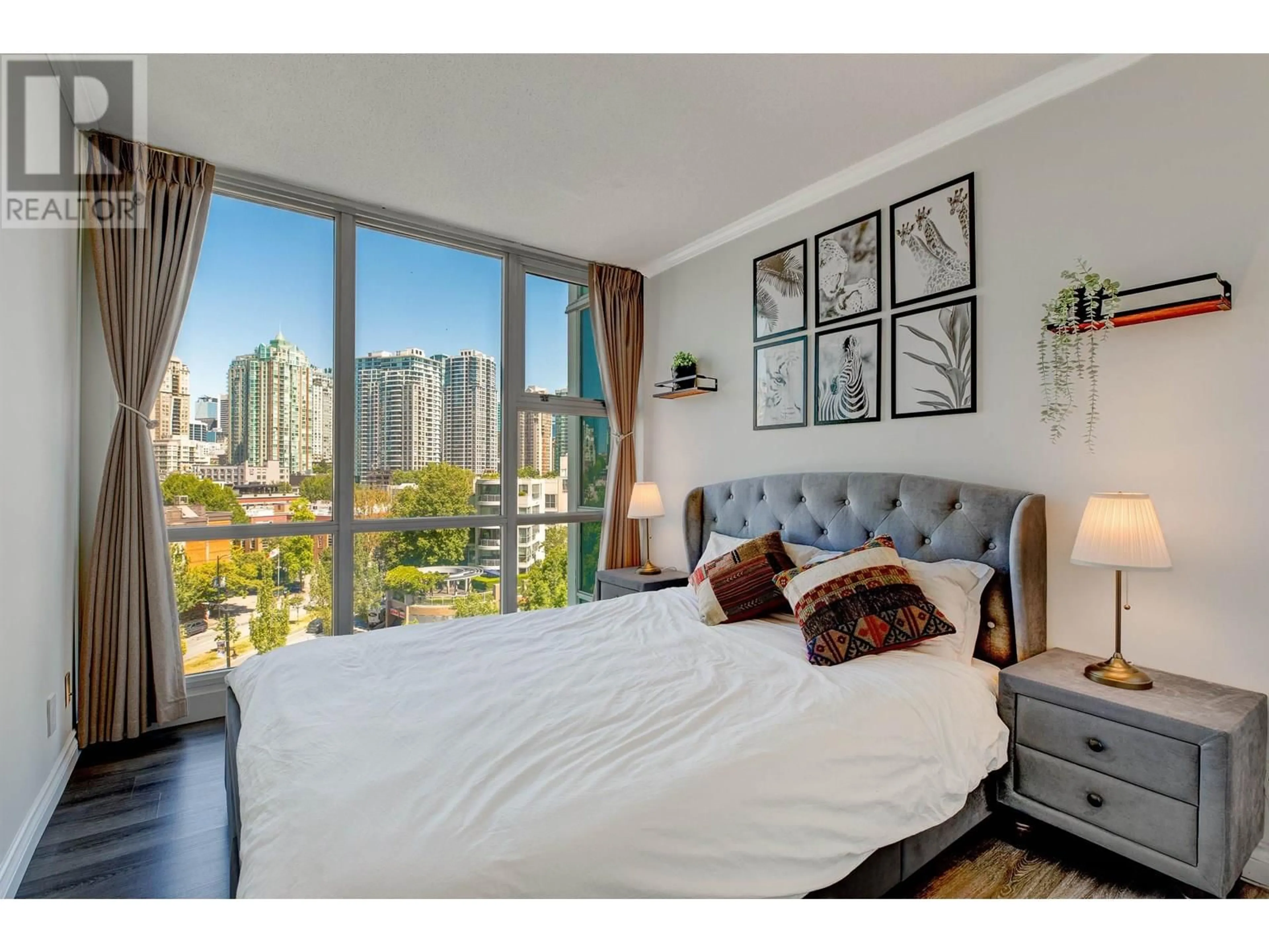 Bedroom with bed, wood/laminate floor for 903 - 193 AQUARIUS MEWS, Vancouver British Columbia V6Z2Z2
