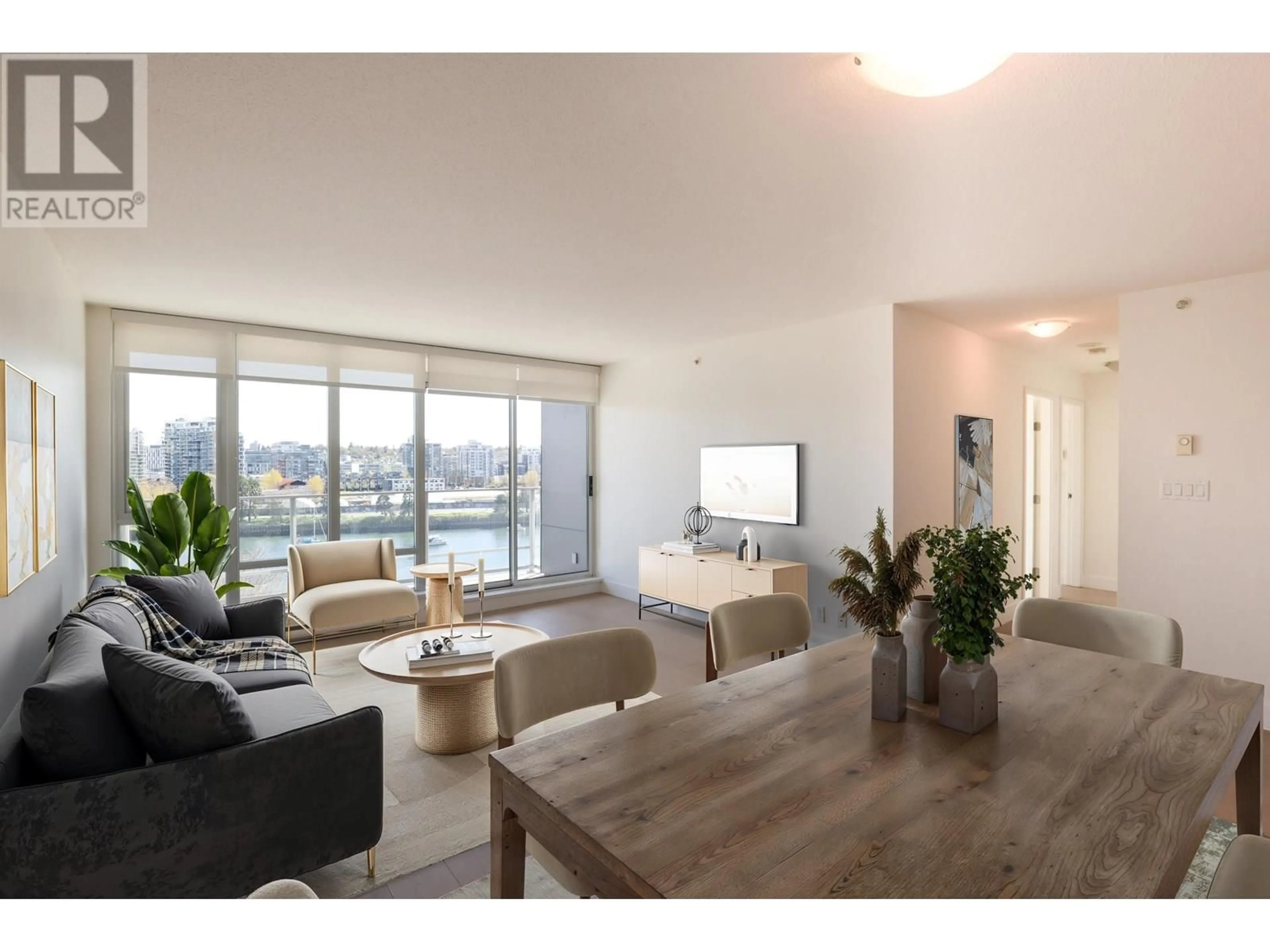 Living room with furniture, wood/laminate floor for 907 - 980 COOPERAGE WAY, Vancouver British Columbia V6B0C3