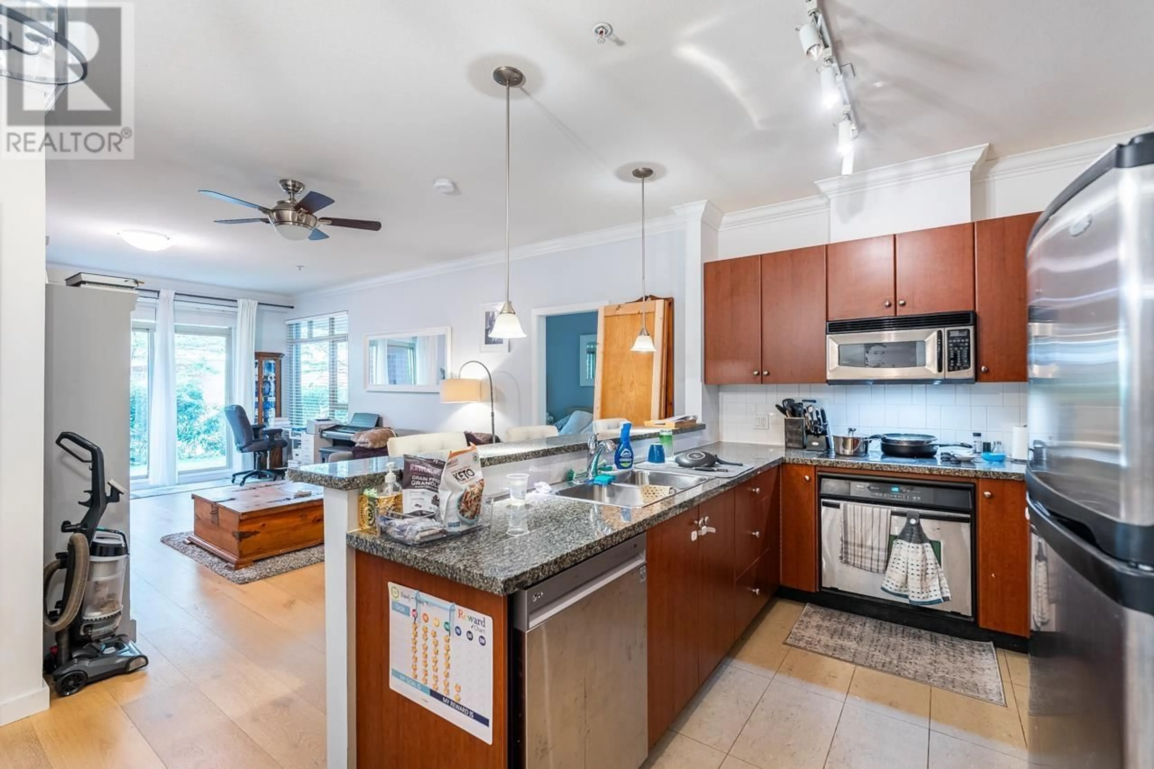 Open concept kitchen, ceramic/tile floor for 103 - 200 CAPILANO ROAD, Port Moody British Columbia V3H5N1