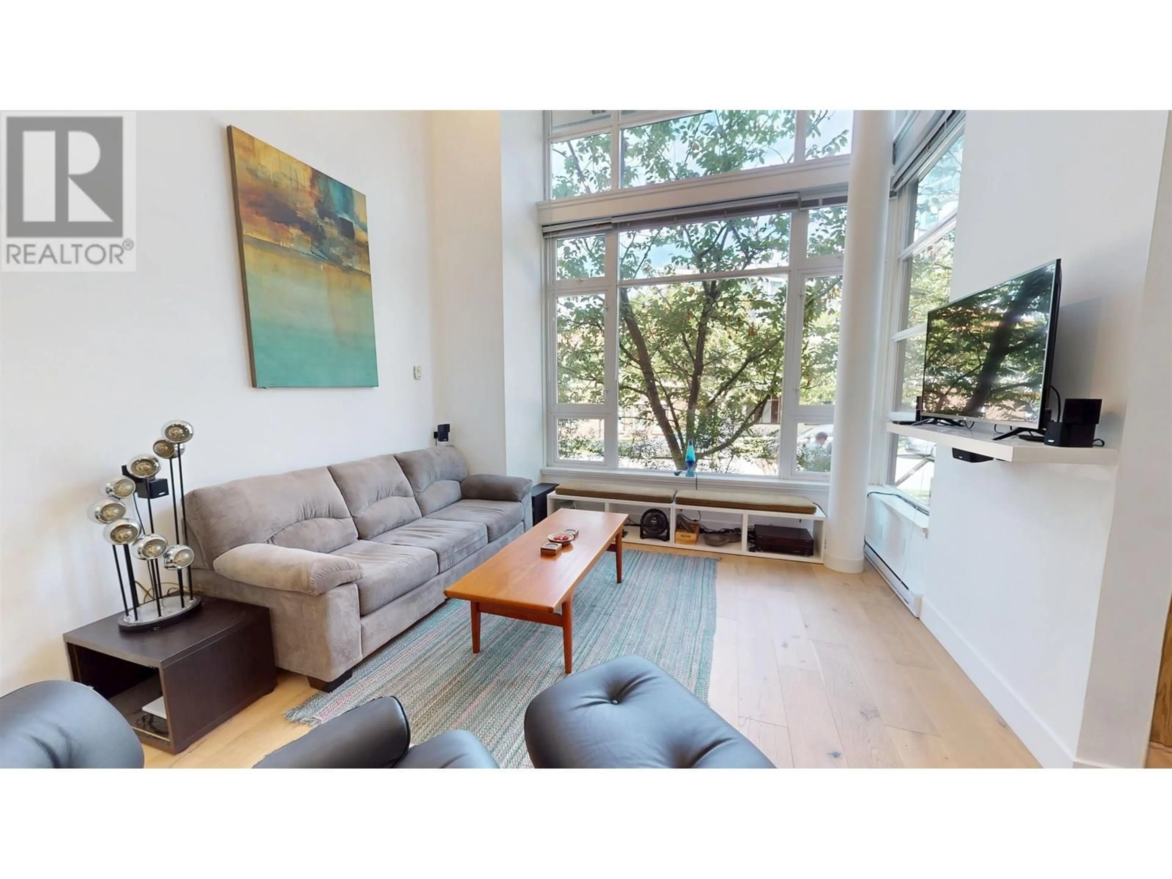 Living room with furniture, wood/laminate floor for 2727 SOPHIA STREET, Vancouver British Columbia V5T3L1